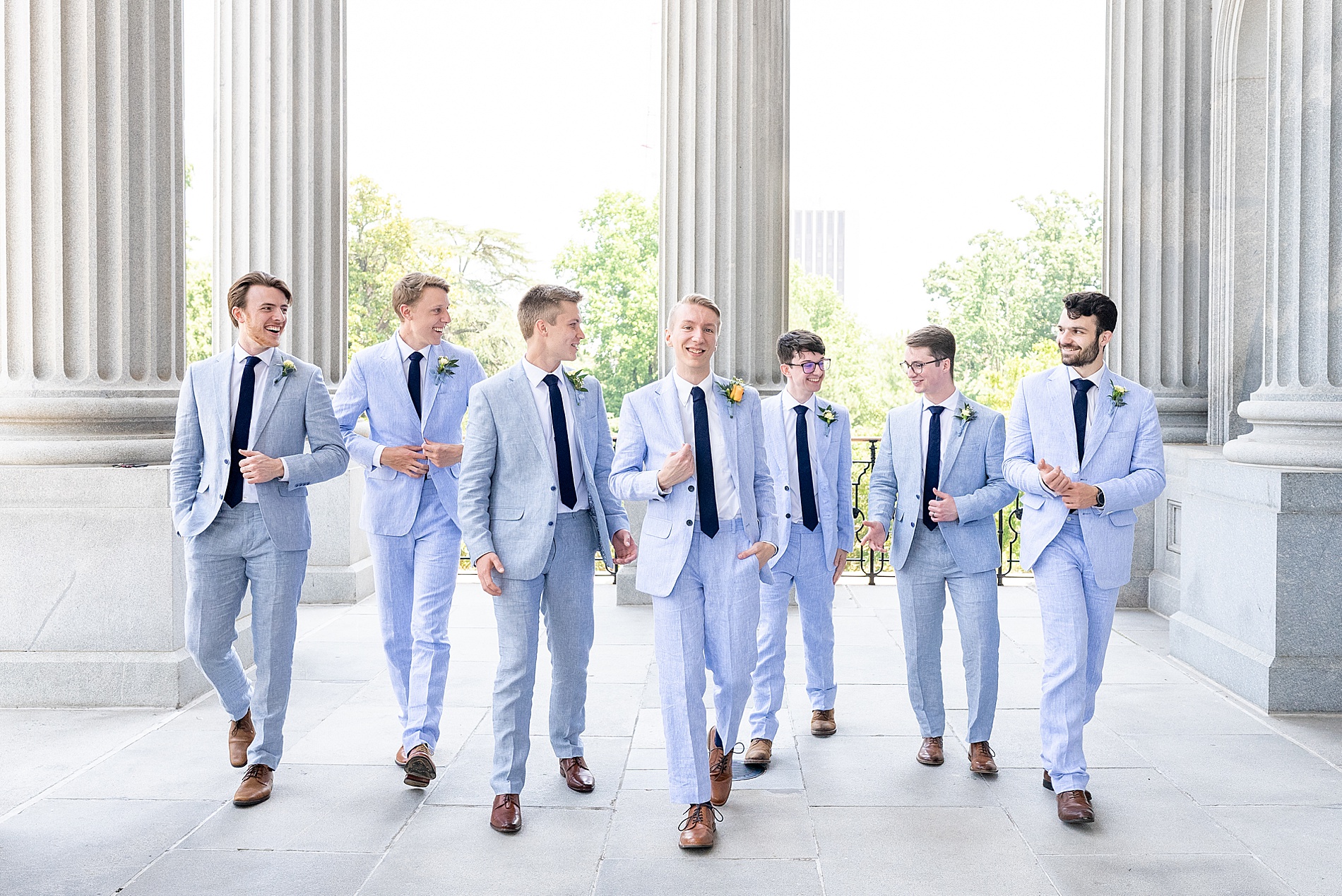 groom and groomsmen walk through the South Carolina State House