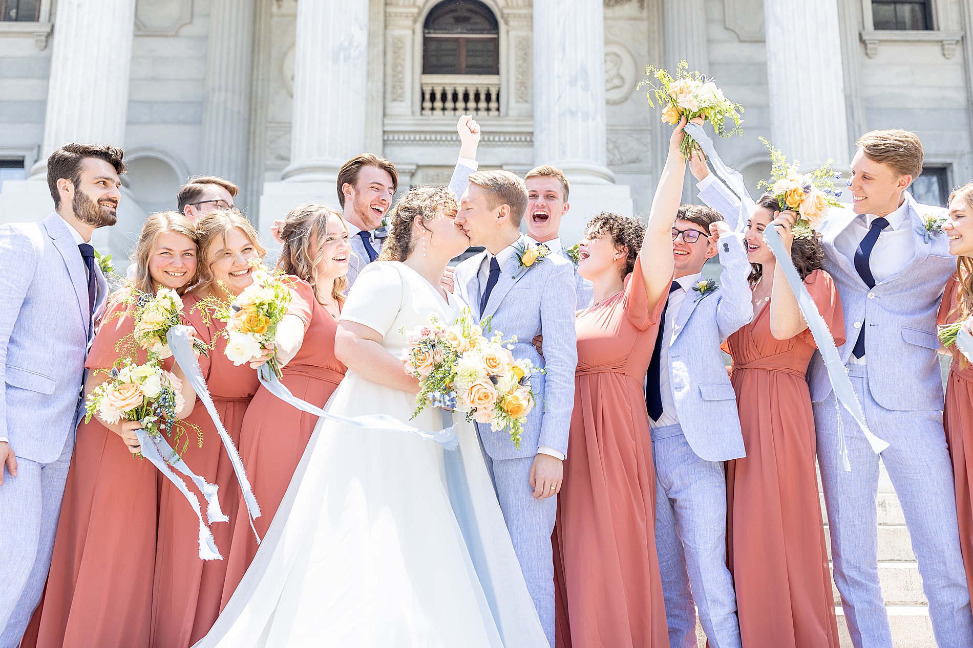 bride and groom kiss during wedding party portraits from Elegant South Carolina Wedding