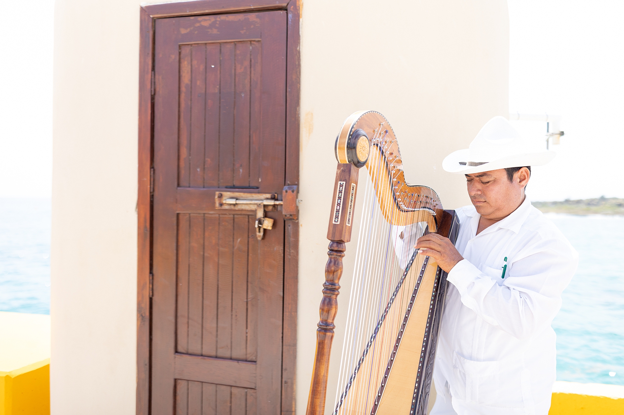 man playing harp
