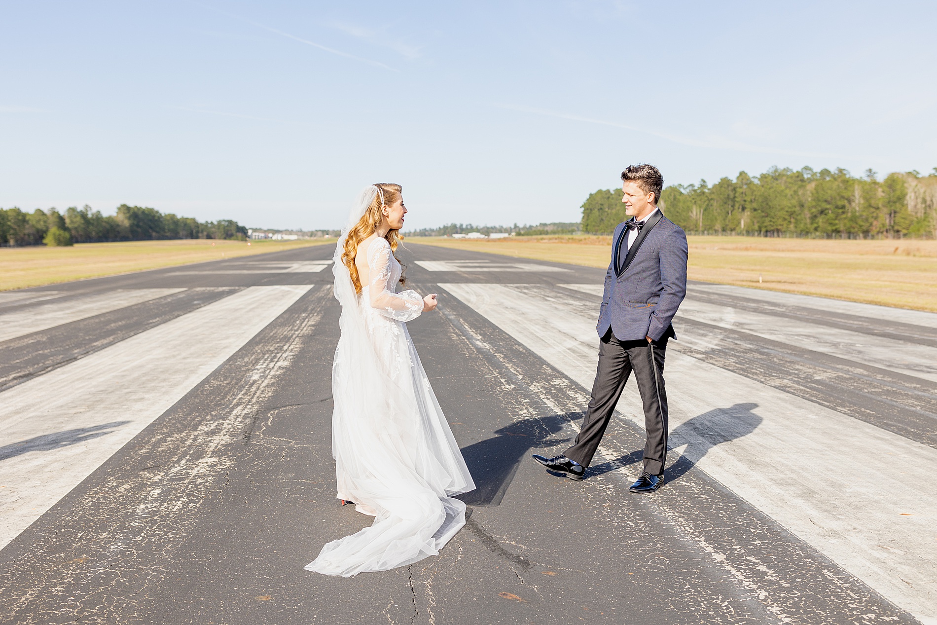 bride and groom first look on airport runway