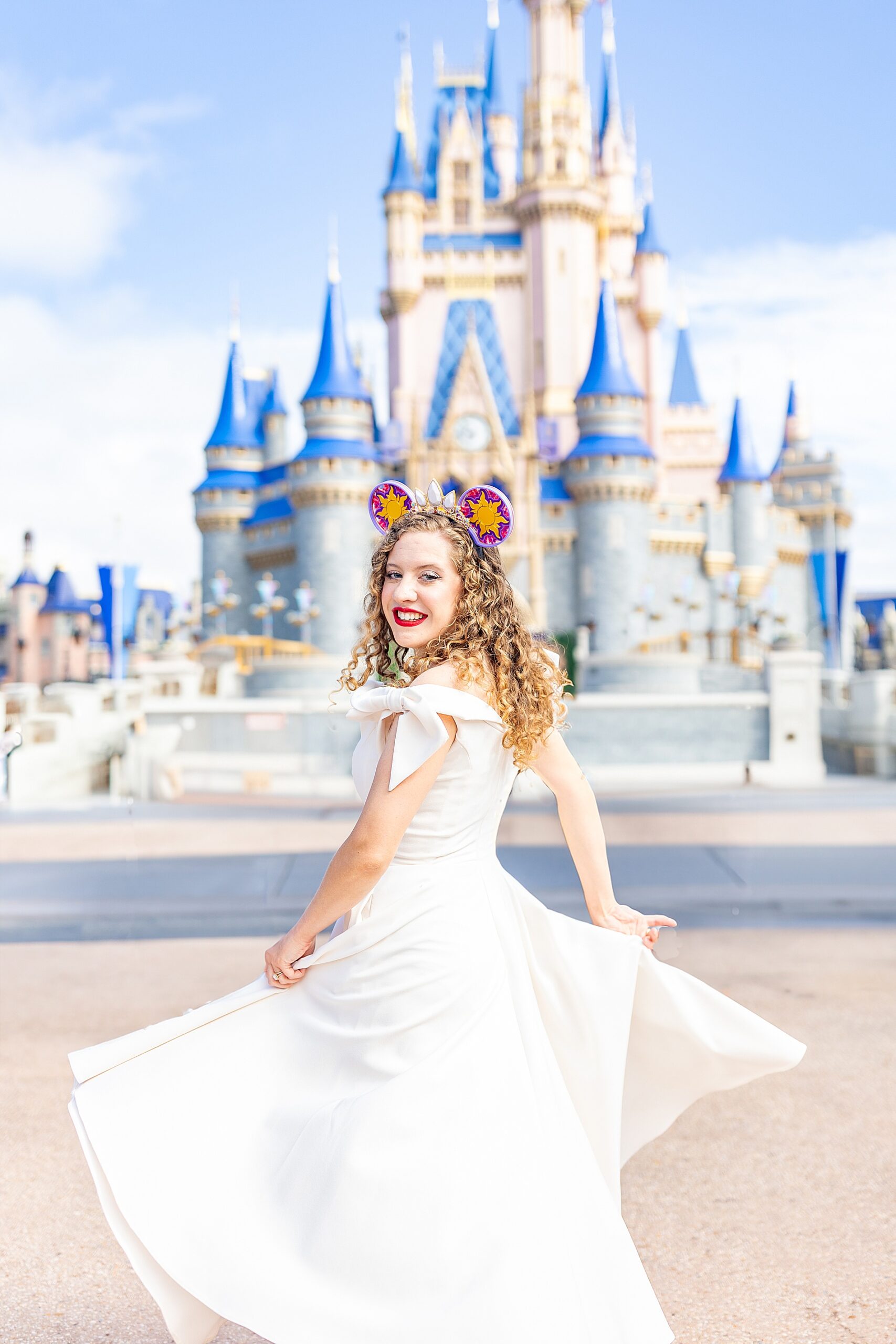 Luxury SC Wedding photographer, Sarah Claire in front of Disney castle