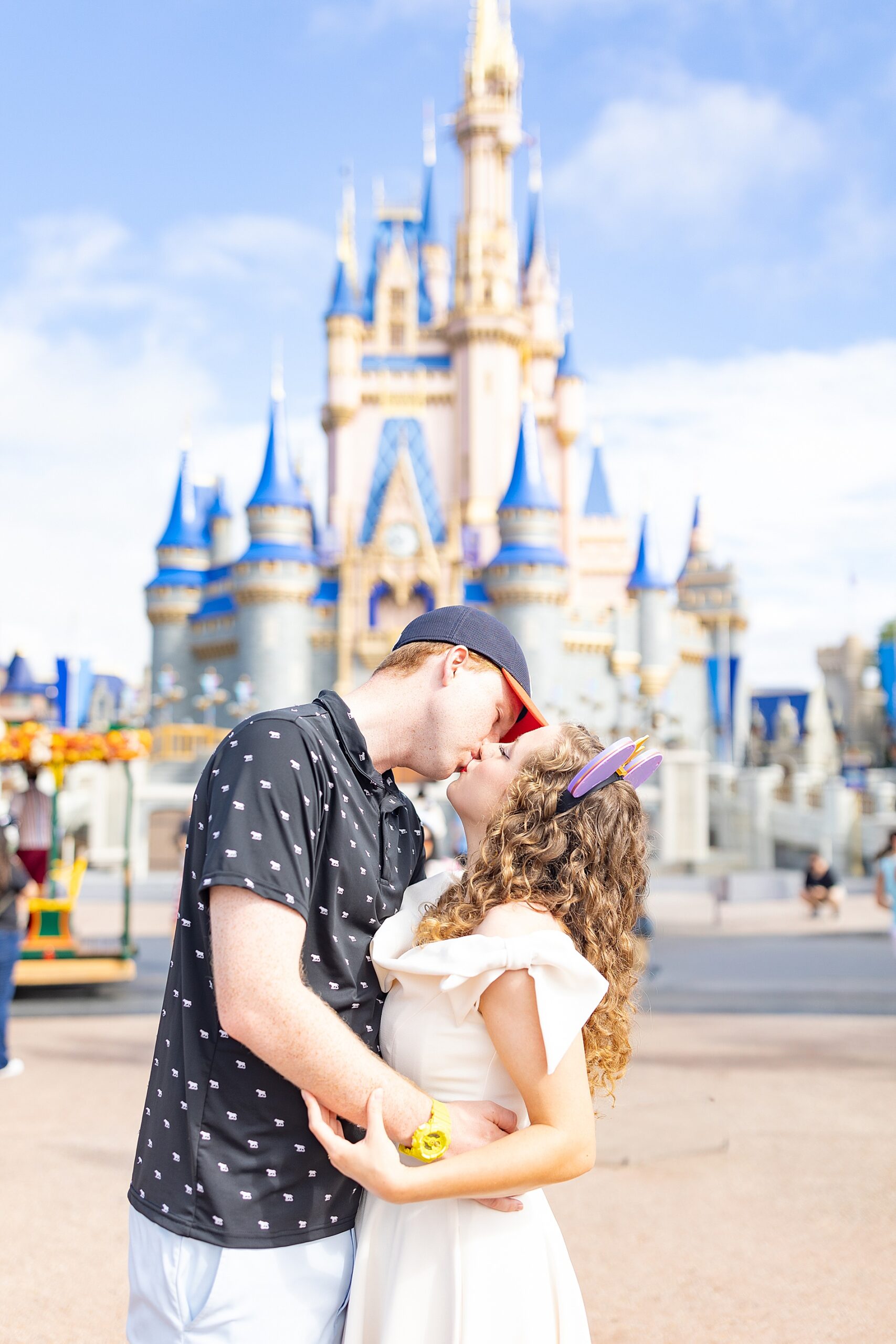 couple kiss in front of castle from Cruise and Disney Trip Experience