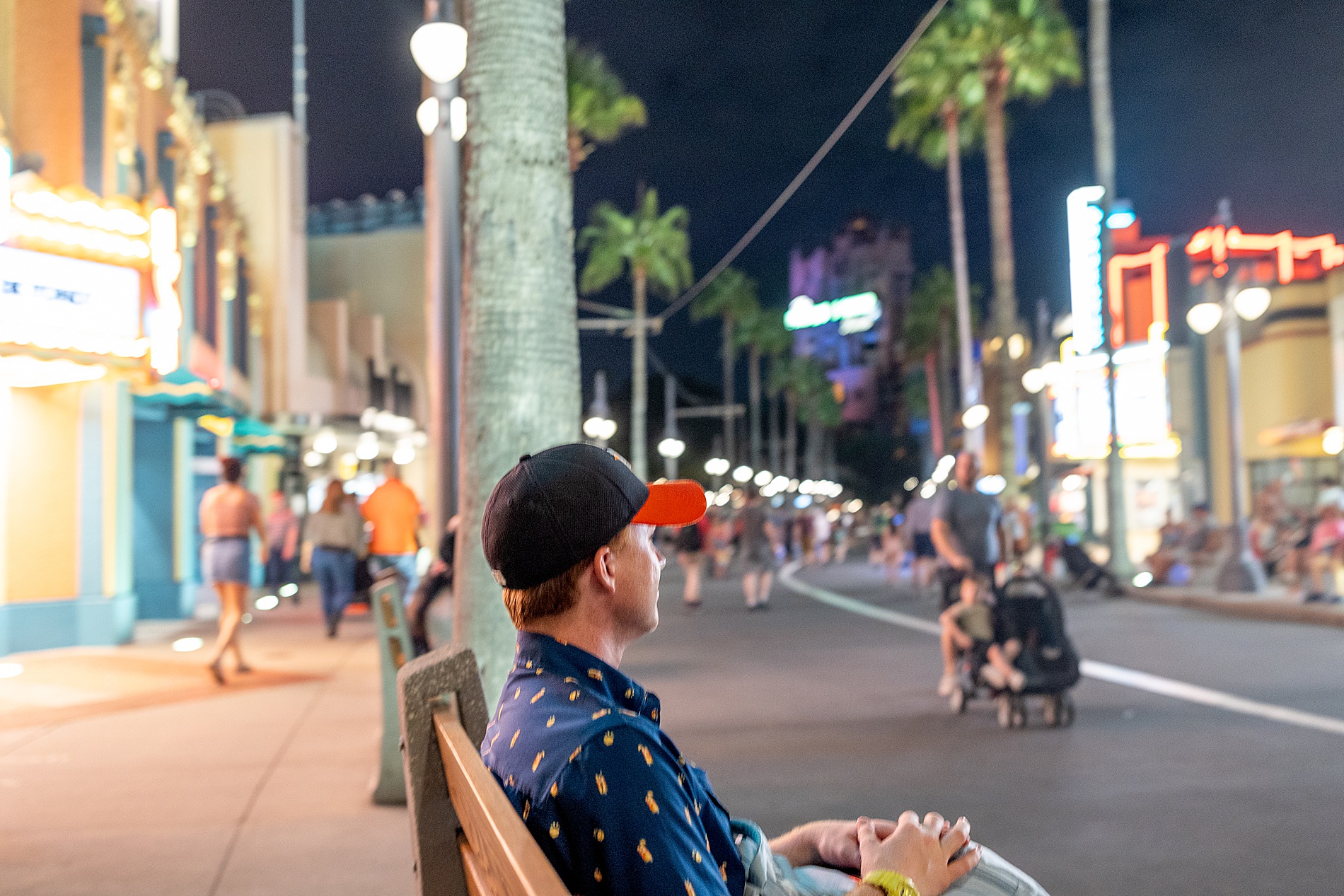 man sitting on bench in Hollywood Studios