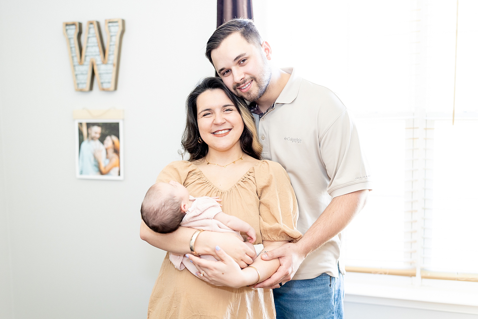 family photos of new parents with newborn
