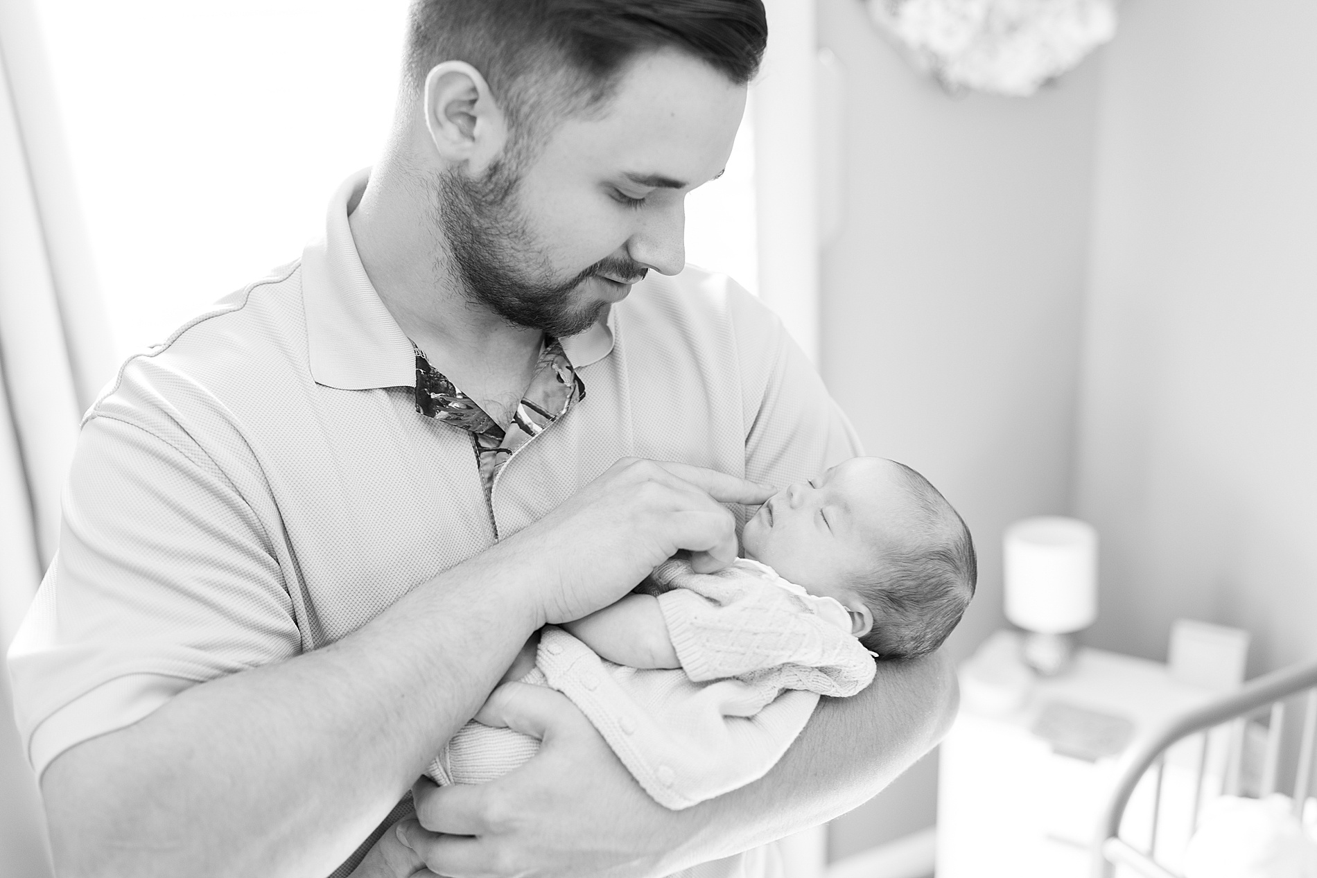 dad holds baby girl