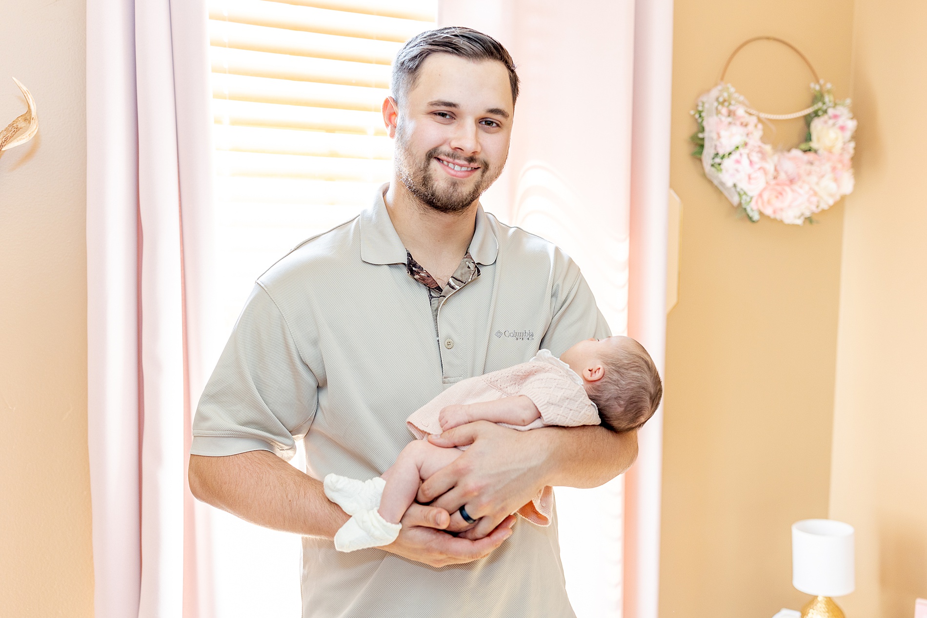 dad holding baby from Greenville In-Home Newborn Session 