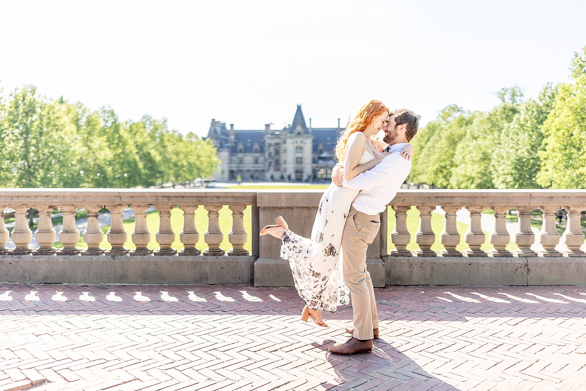 Romantic Biltmore Estate Engagement photos on balcony