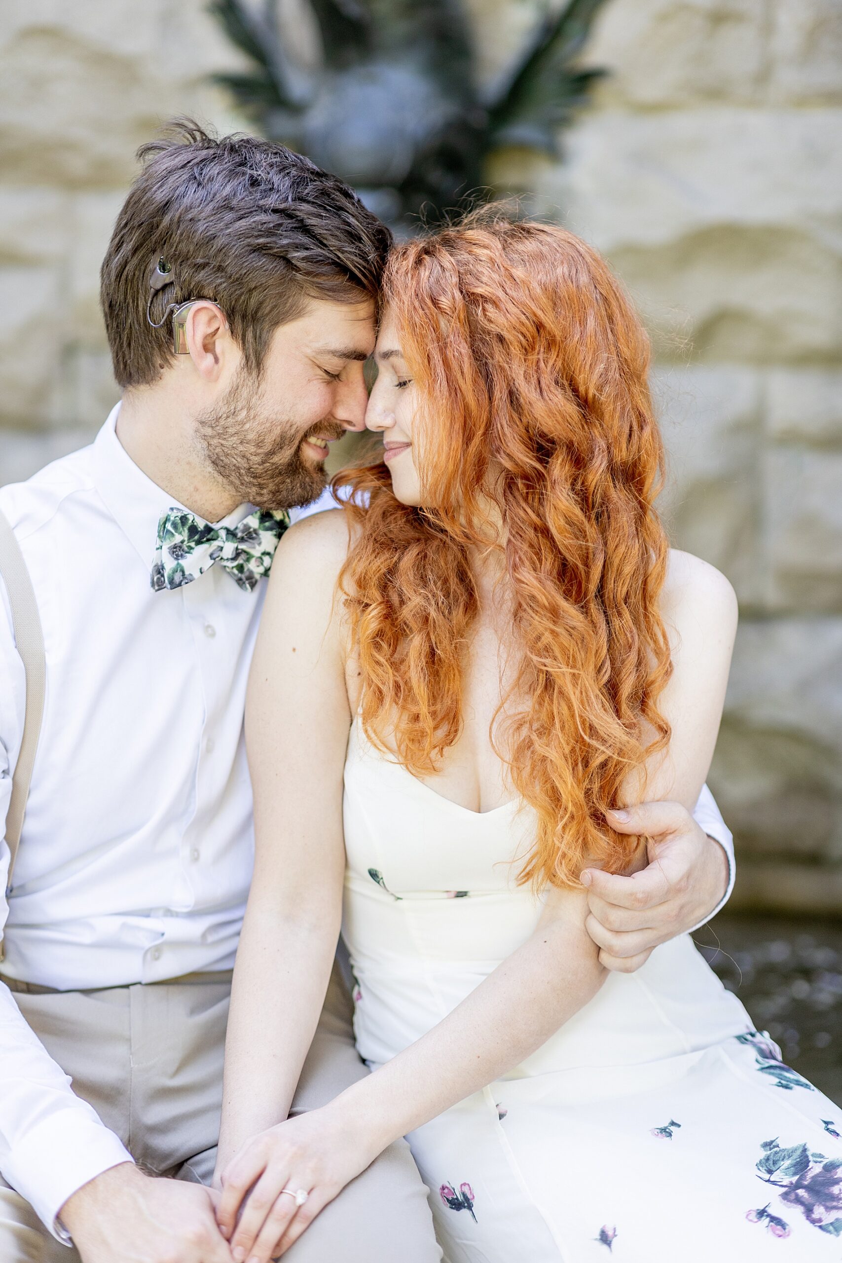 couple sit together on the grounds of Biltmore Estate 