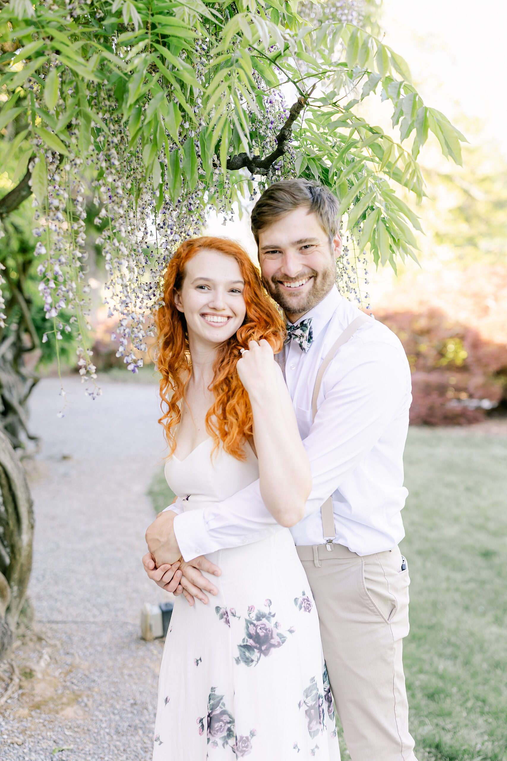 Engagement photos under wisteria flower