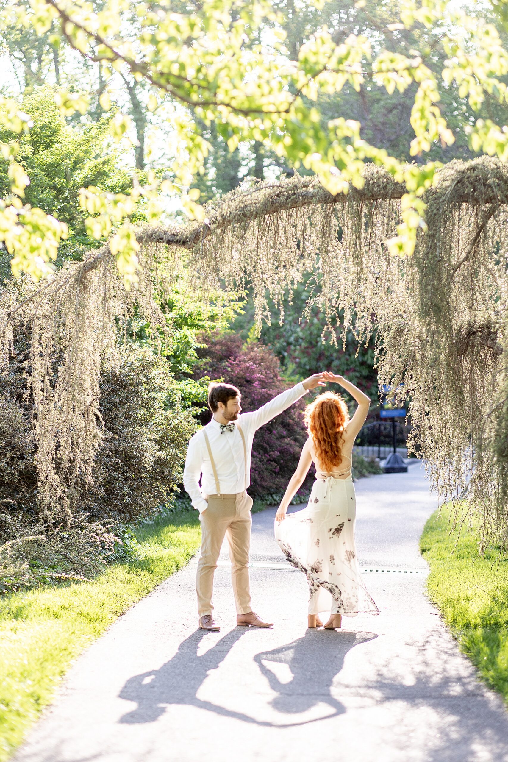 couple dancing under spanish moss covered tree