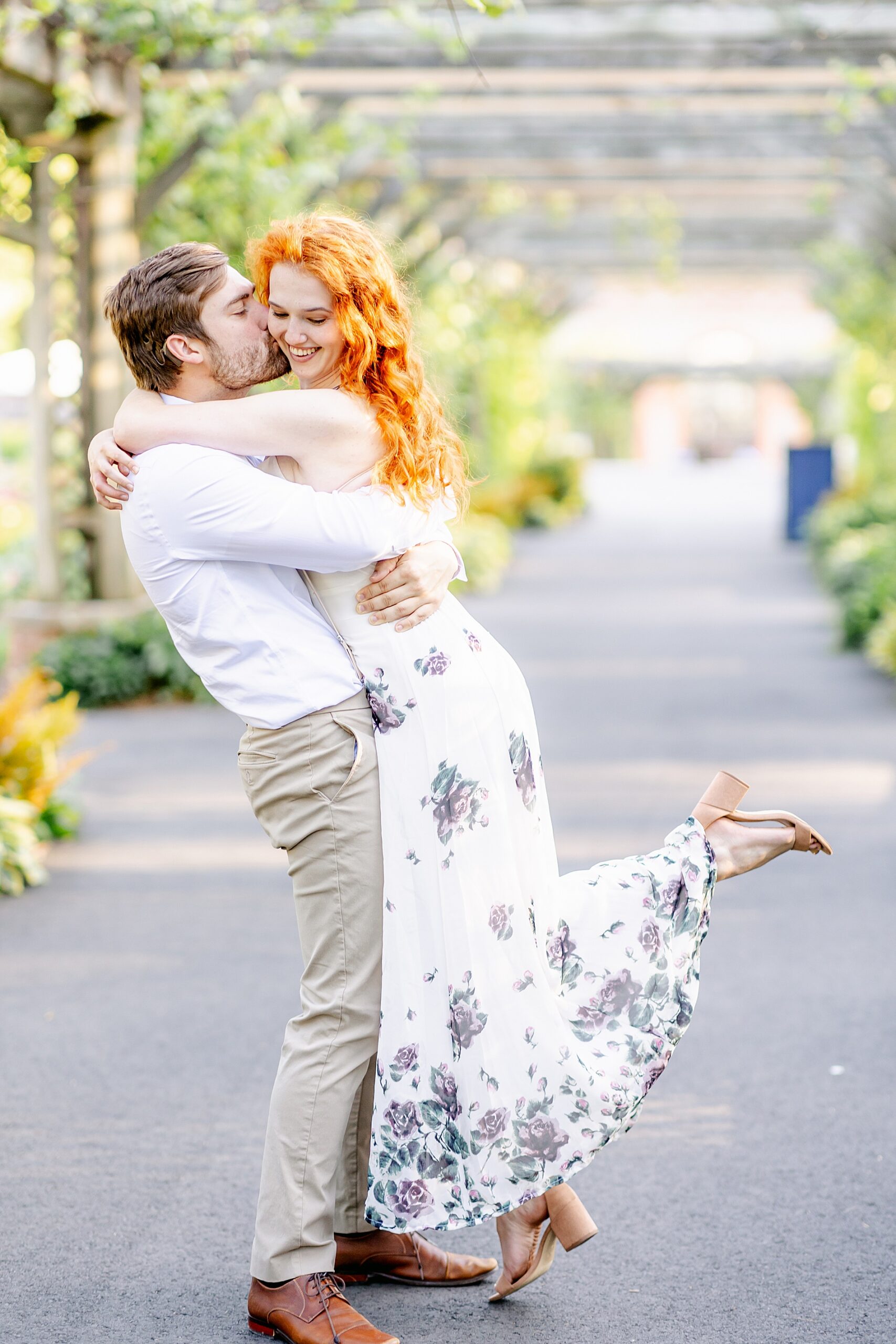 guy hugs and kisses his fiance's cheek