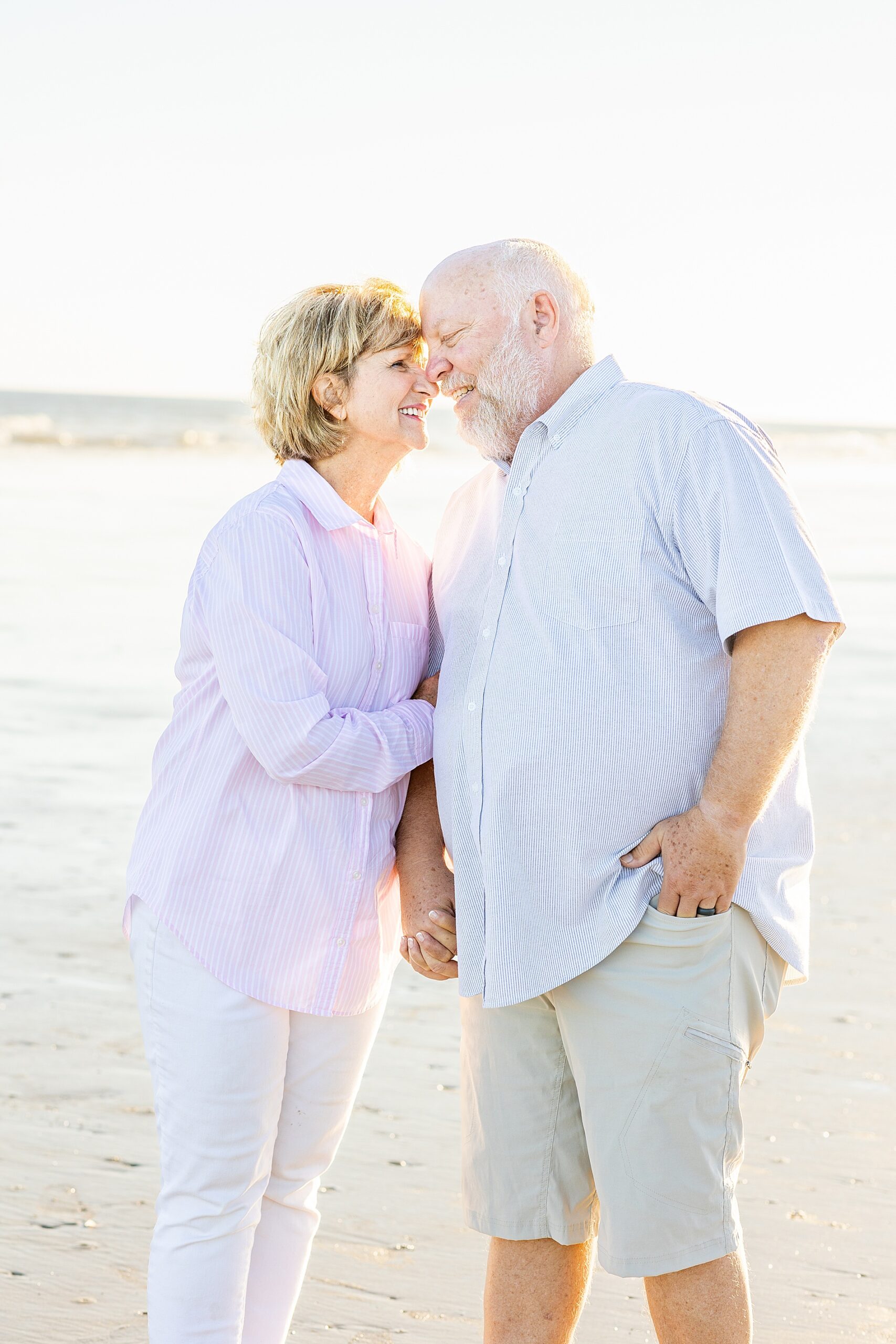 timeless and classic photo of couple on the beach at sunset