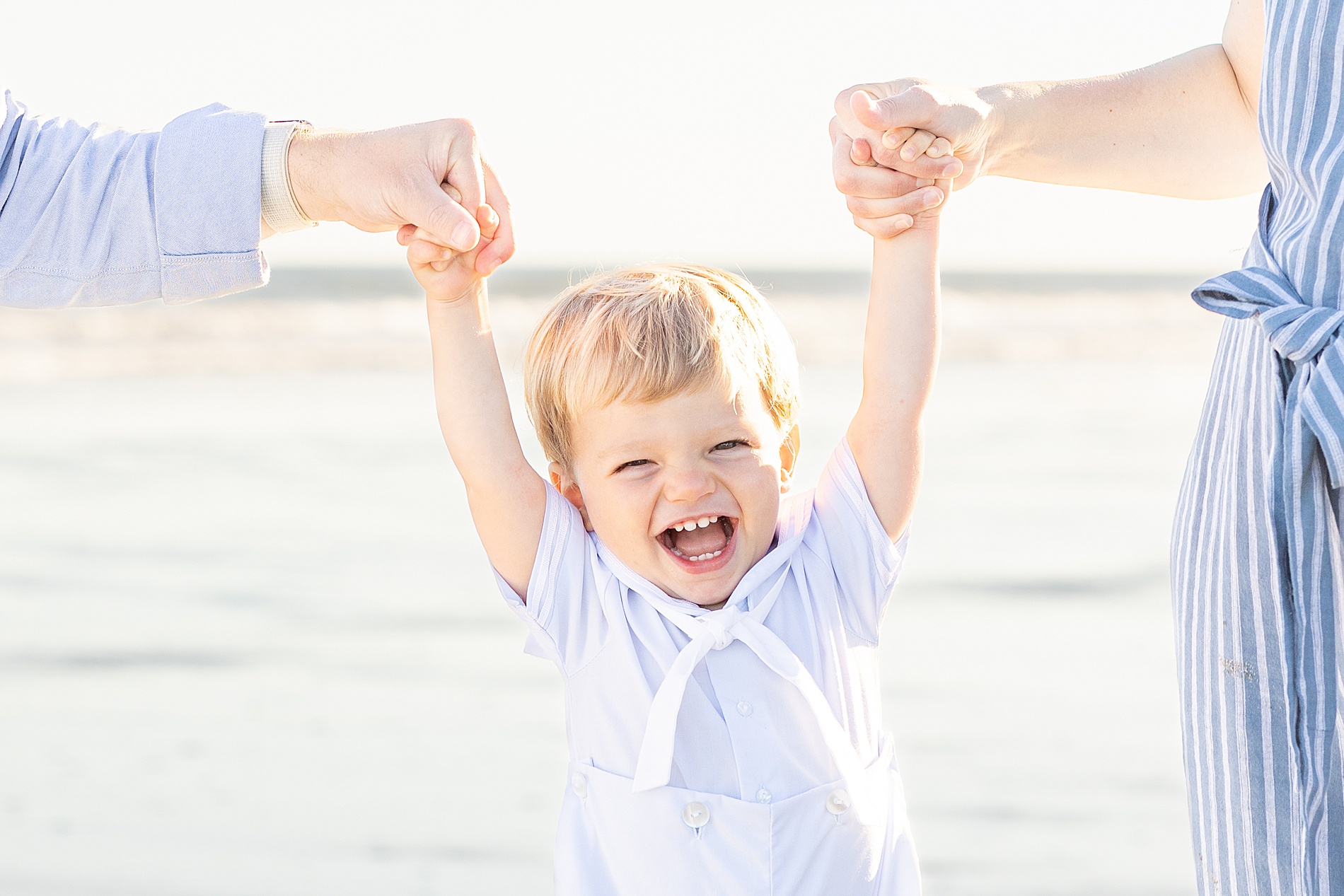 candid photo of little boy laughing 