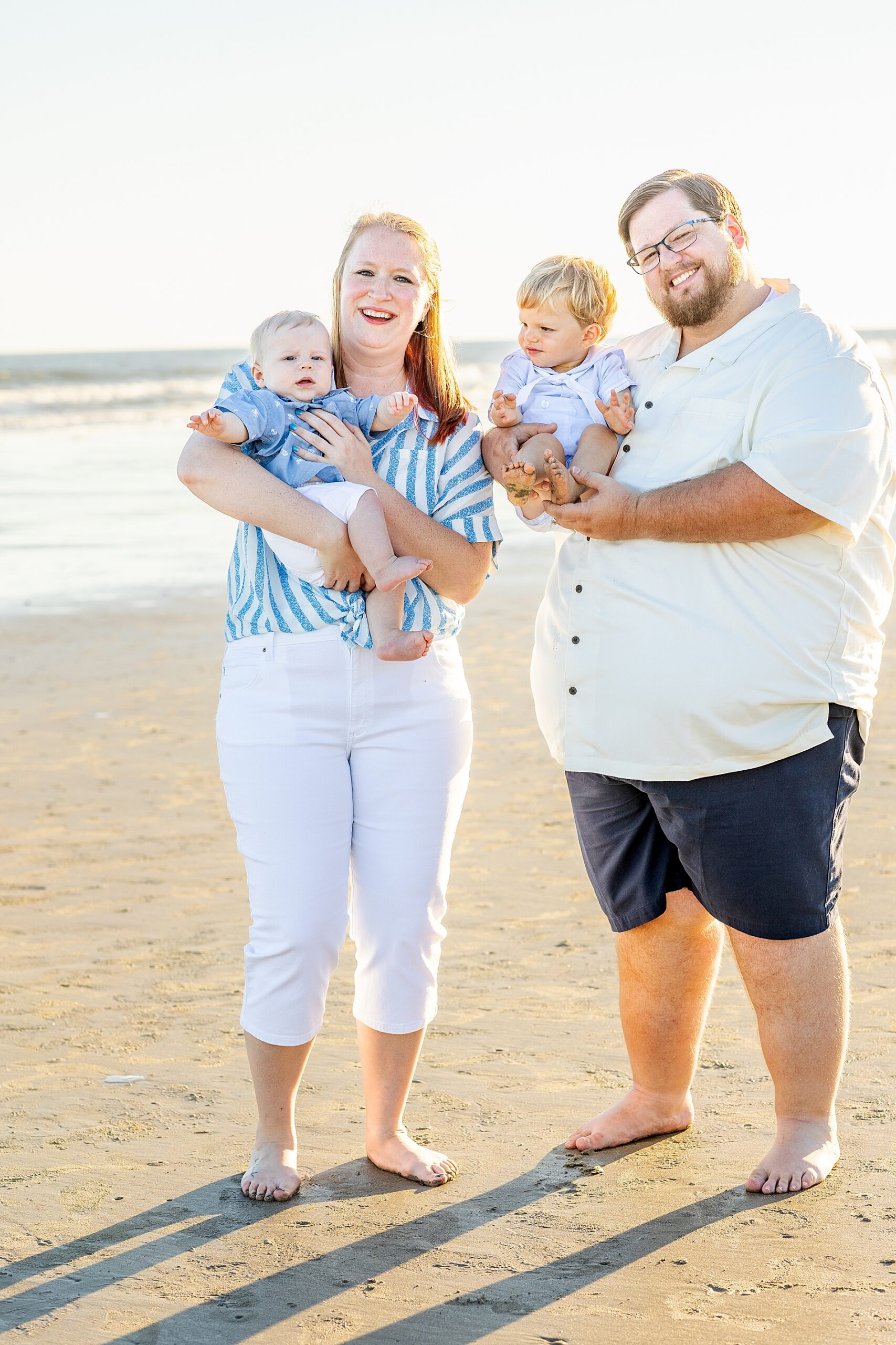 aunt and uncle hold nephews