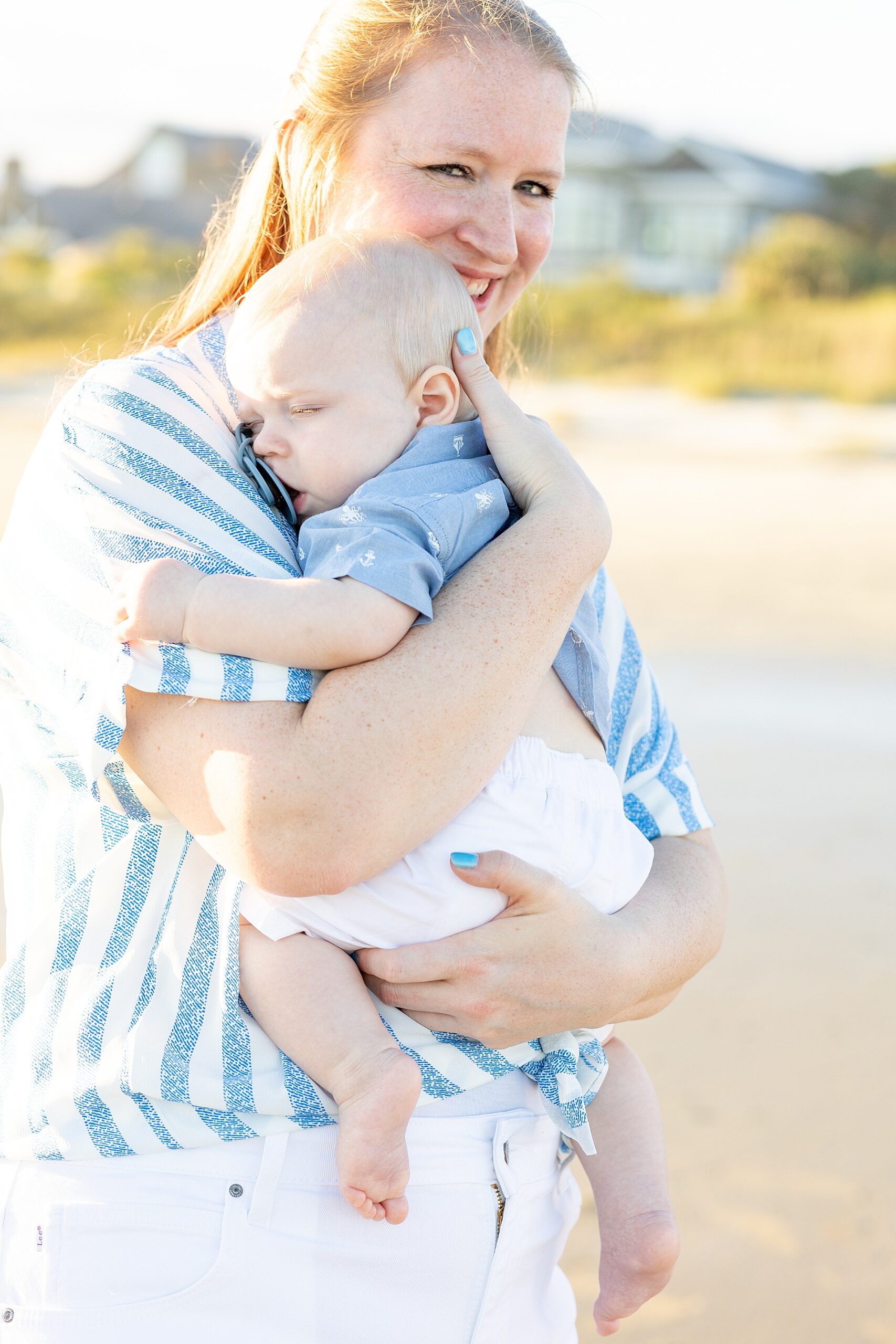 aunt holds nephew during Charleston Beach Family Session