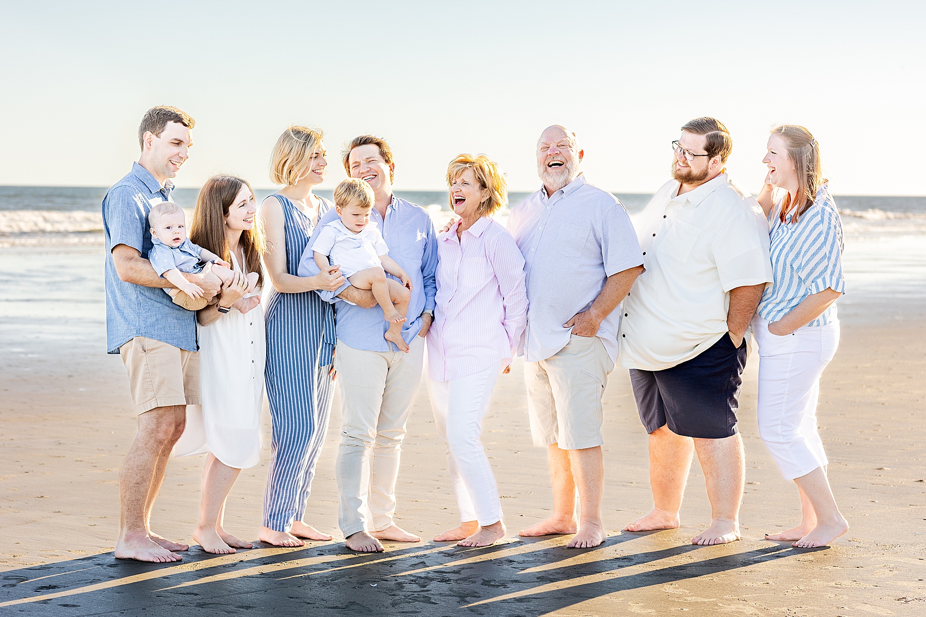 candid extended family session in Charleston at the beach