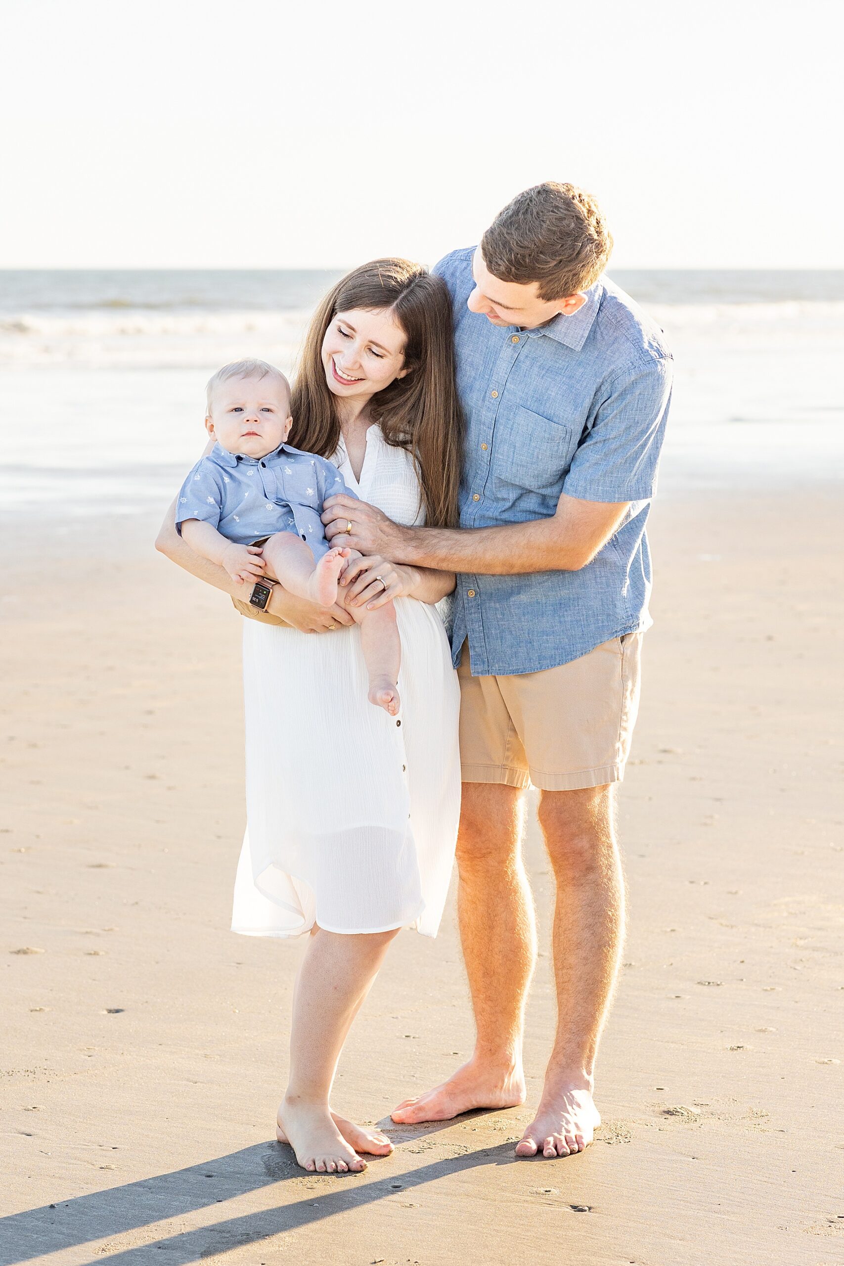 family of three on Charleston beach