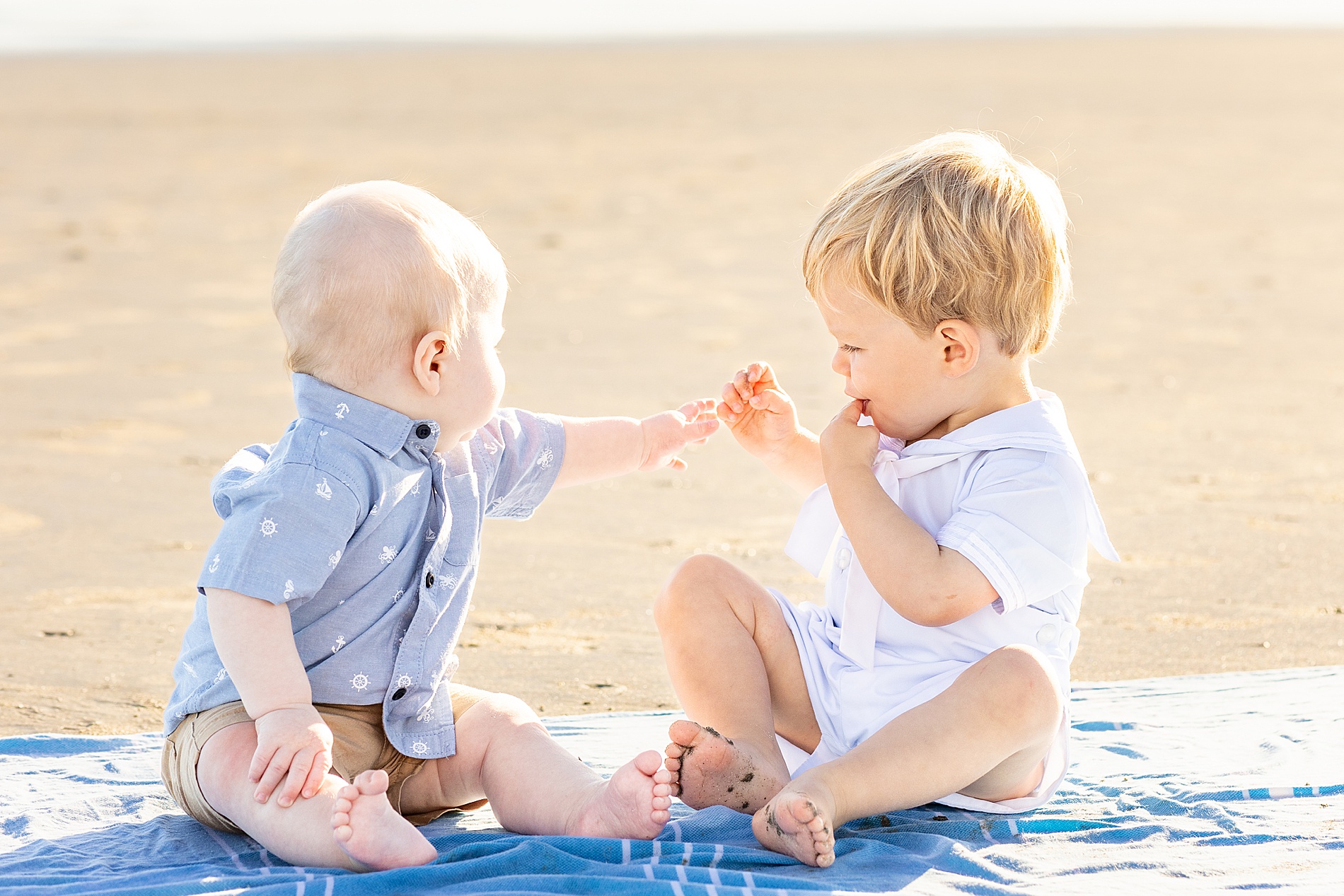 cousins play on the beach