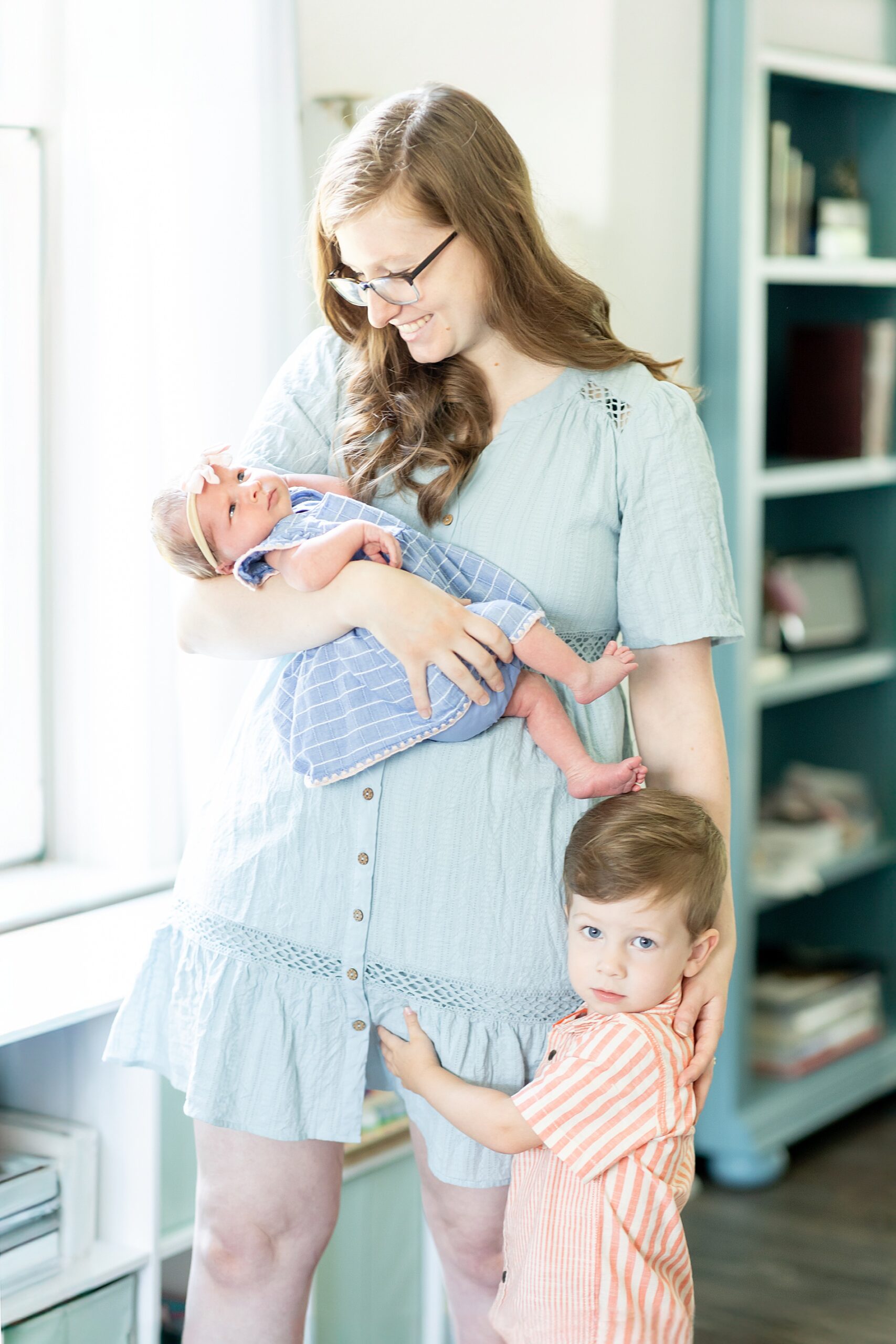 mom with her two kids during In-Home Lifestyle Newborn Session