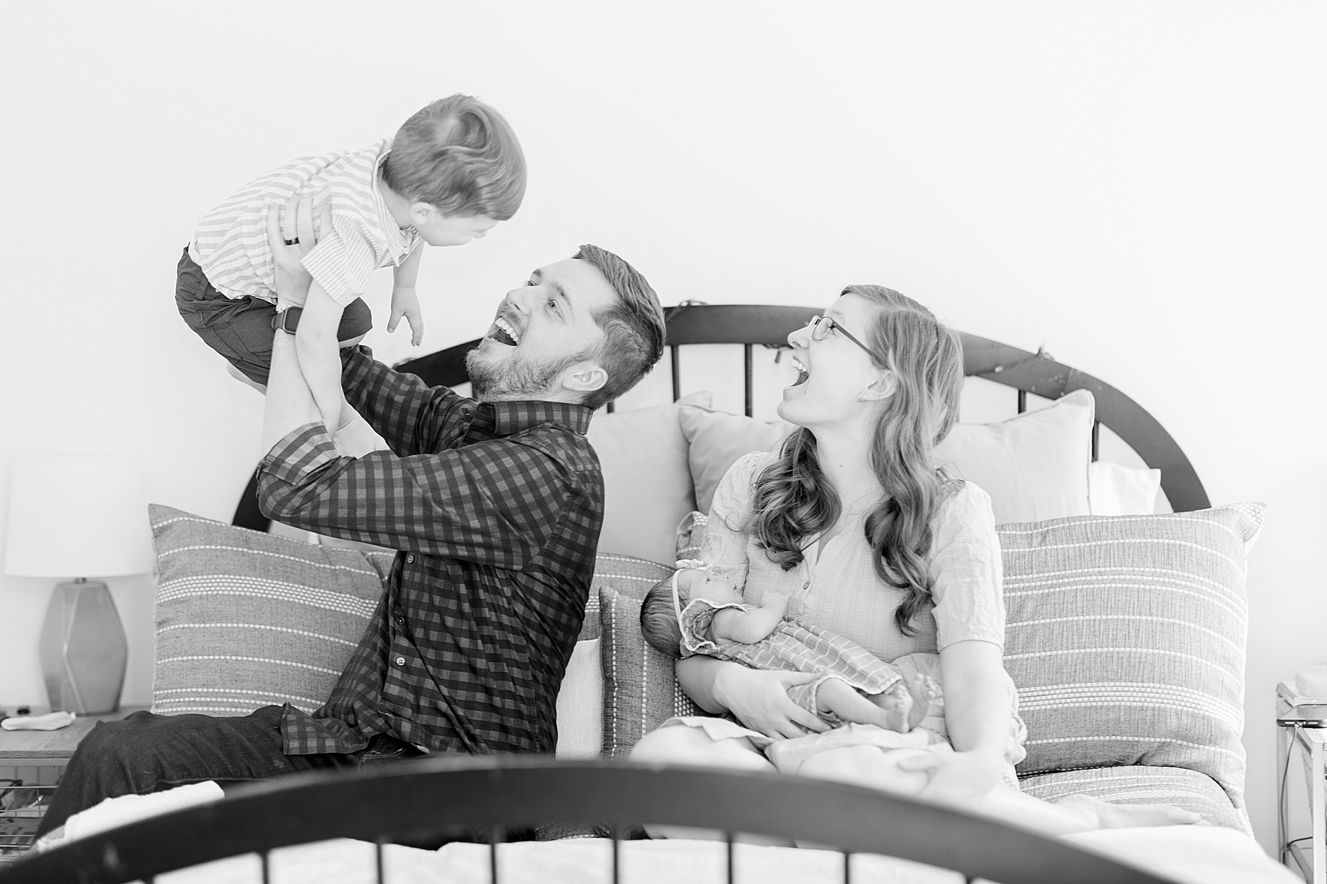 candid family photo from In-Home Lifestyle Newborn Session