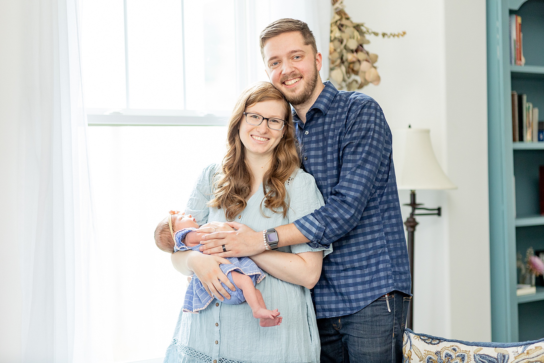 mom and dad with newborn girl