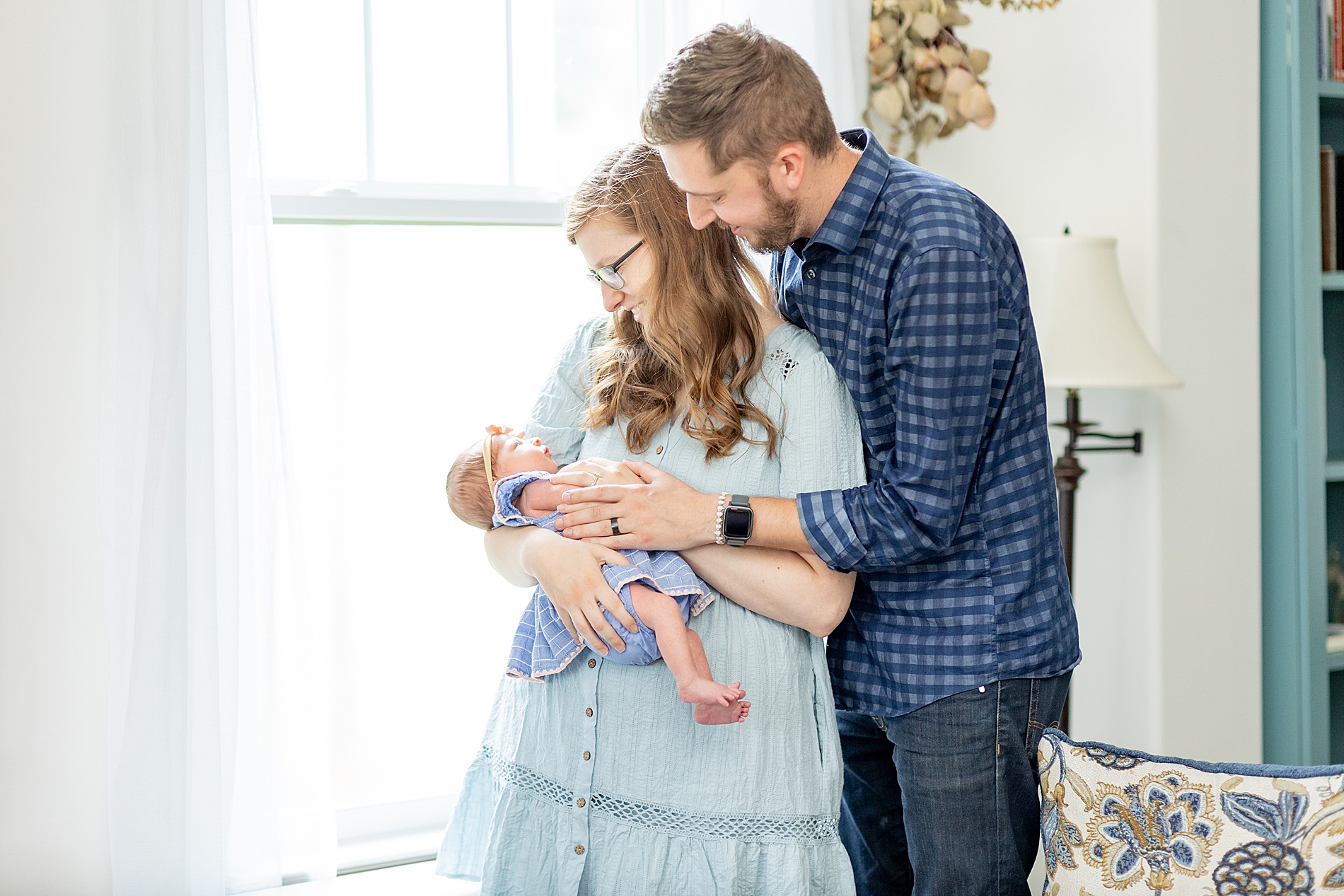 timeless family photos of mom and dad with newborn