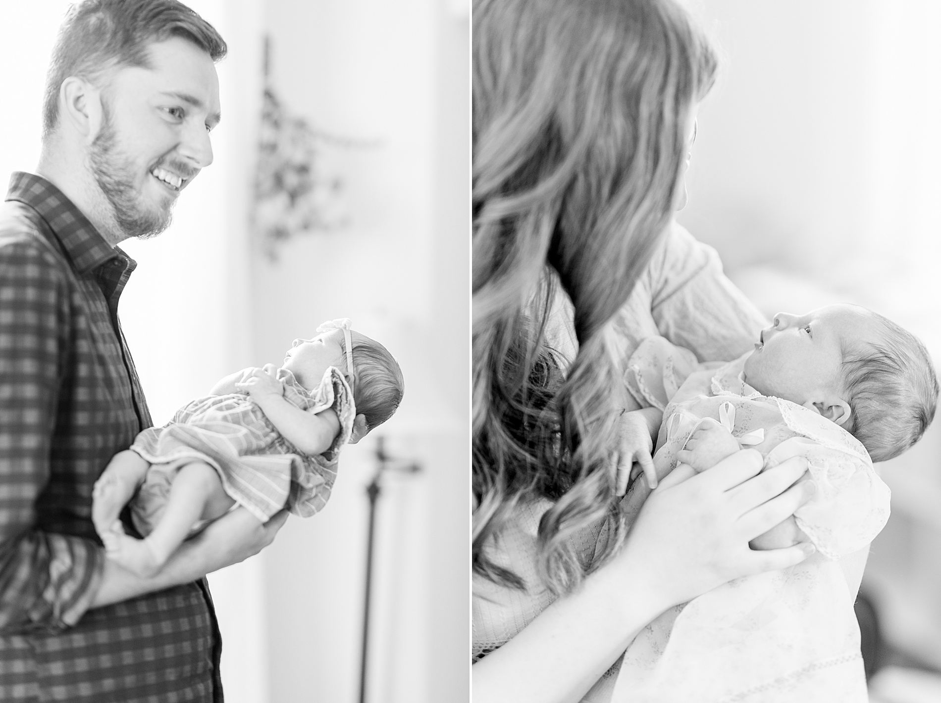 mom and dad hold newborn 