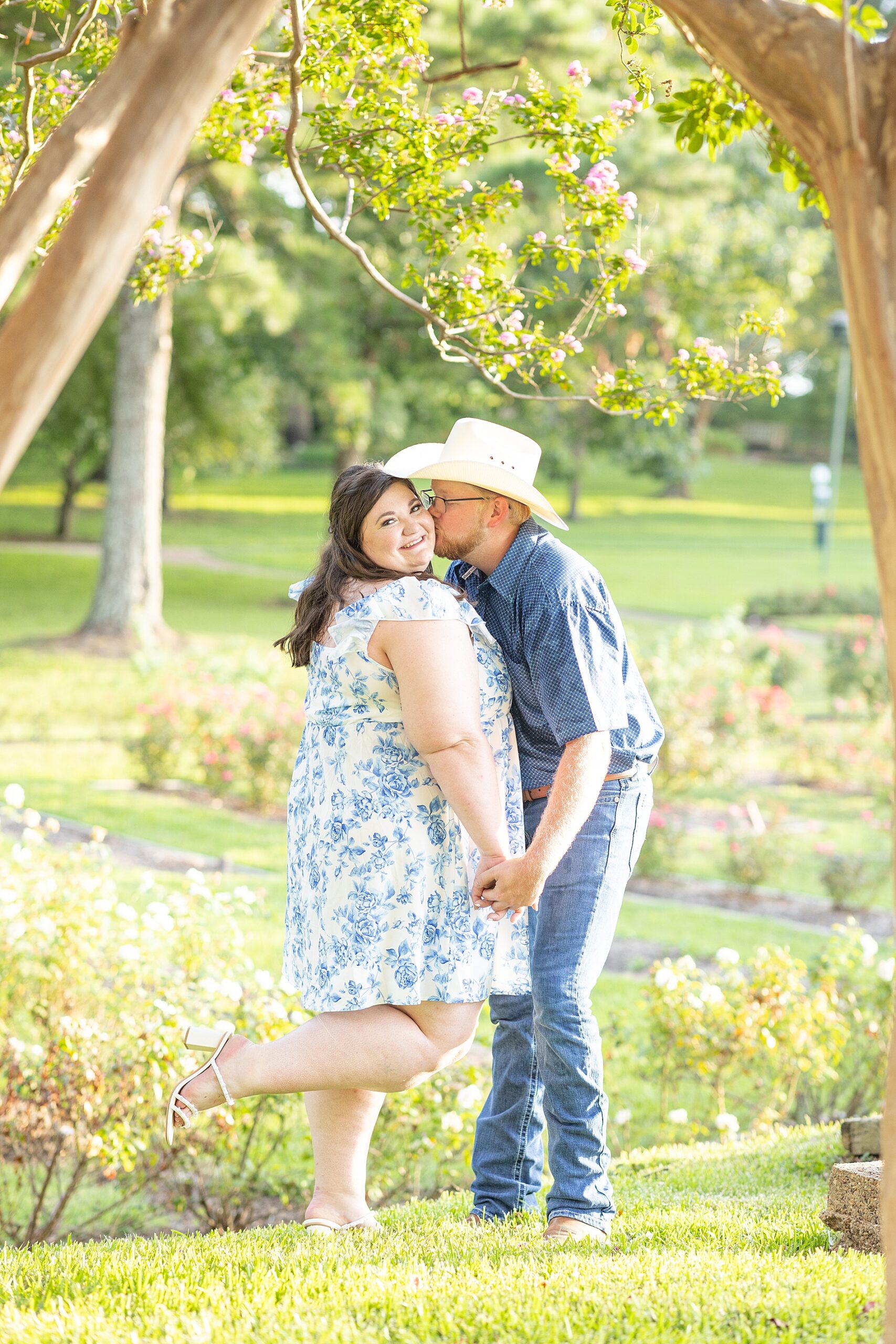 man kisses fiance's cheek