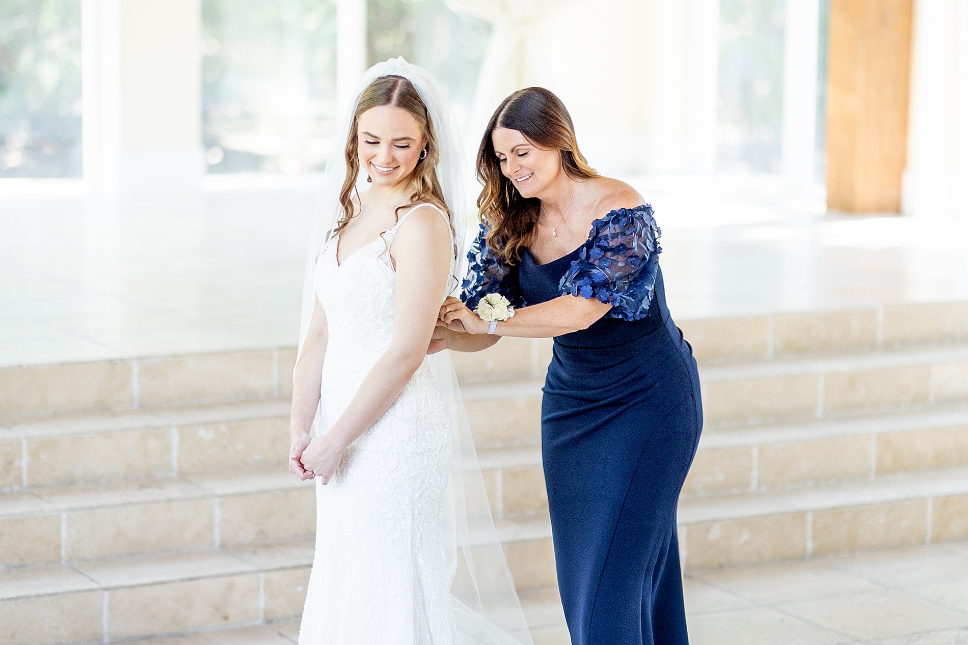 bride gets in dress