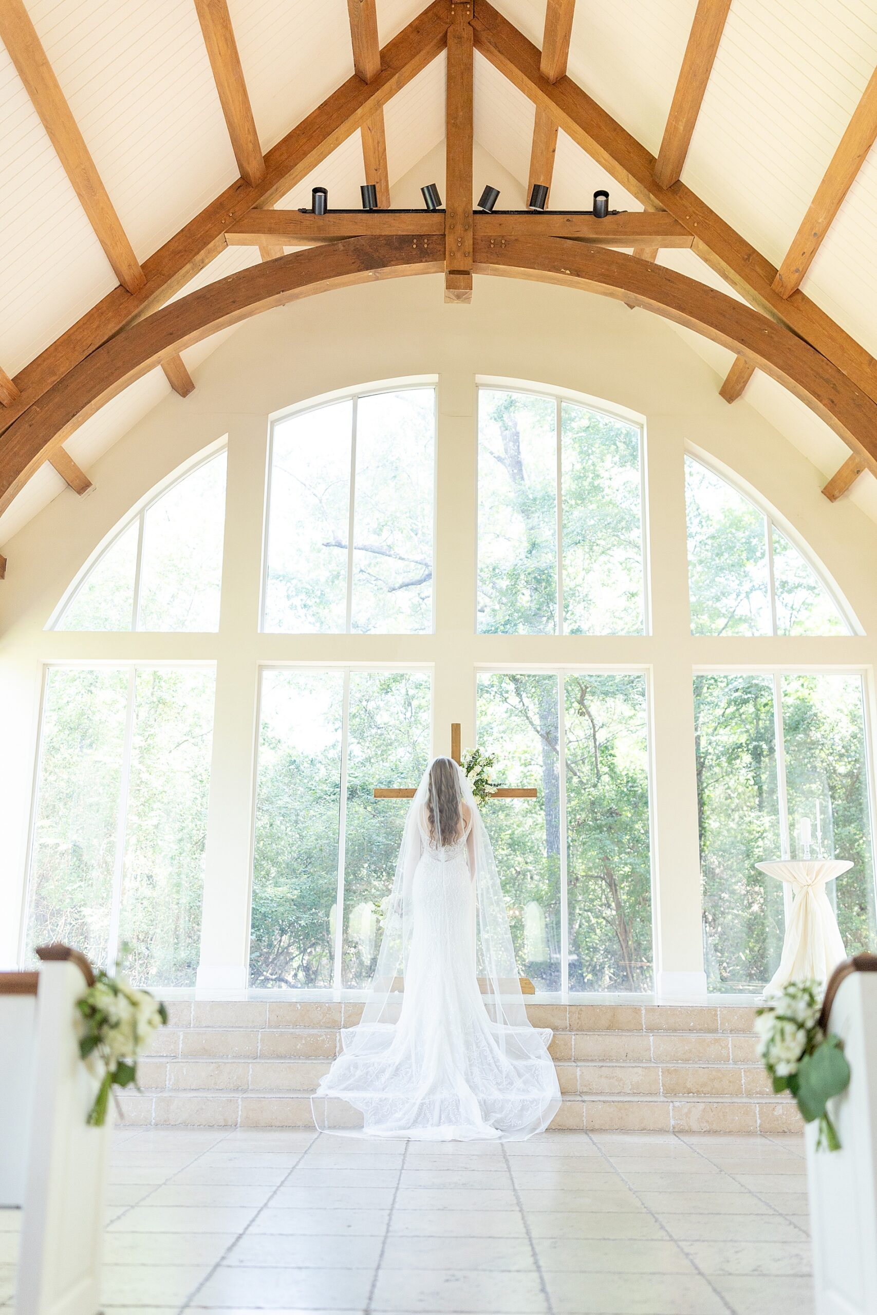 back of bride's wedding dress in chapel