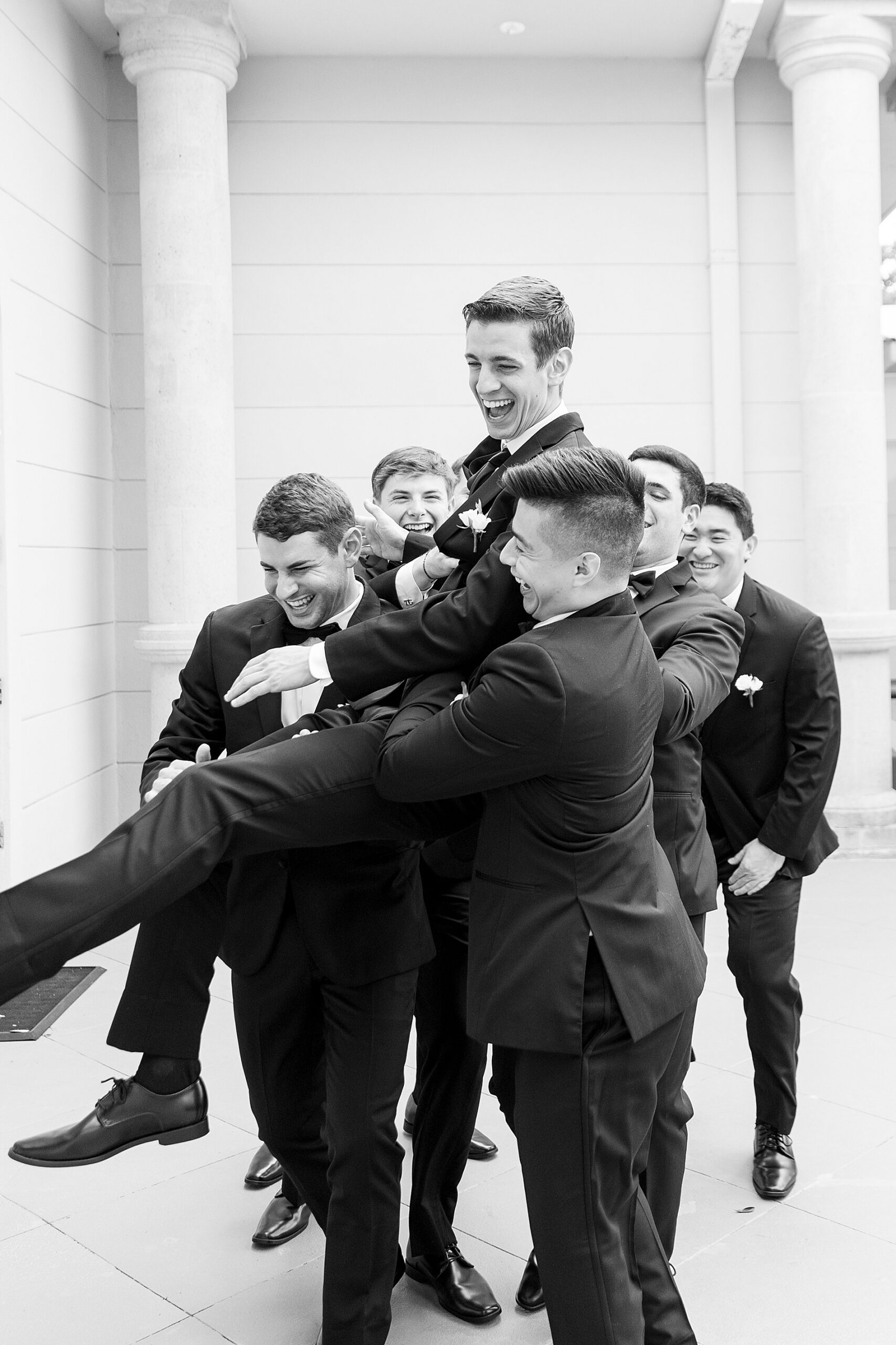 candid wedding photos of groom and groomsmen