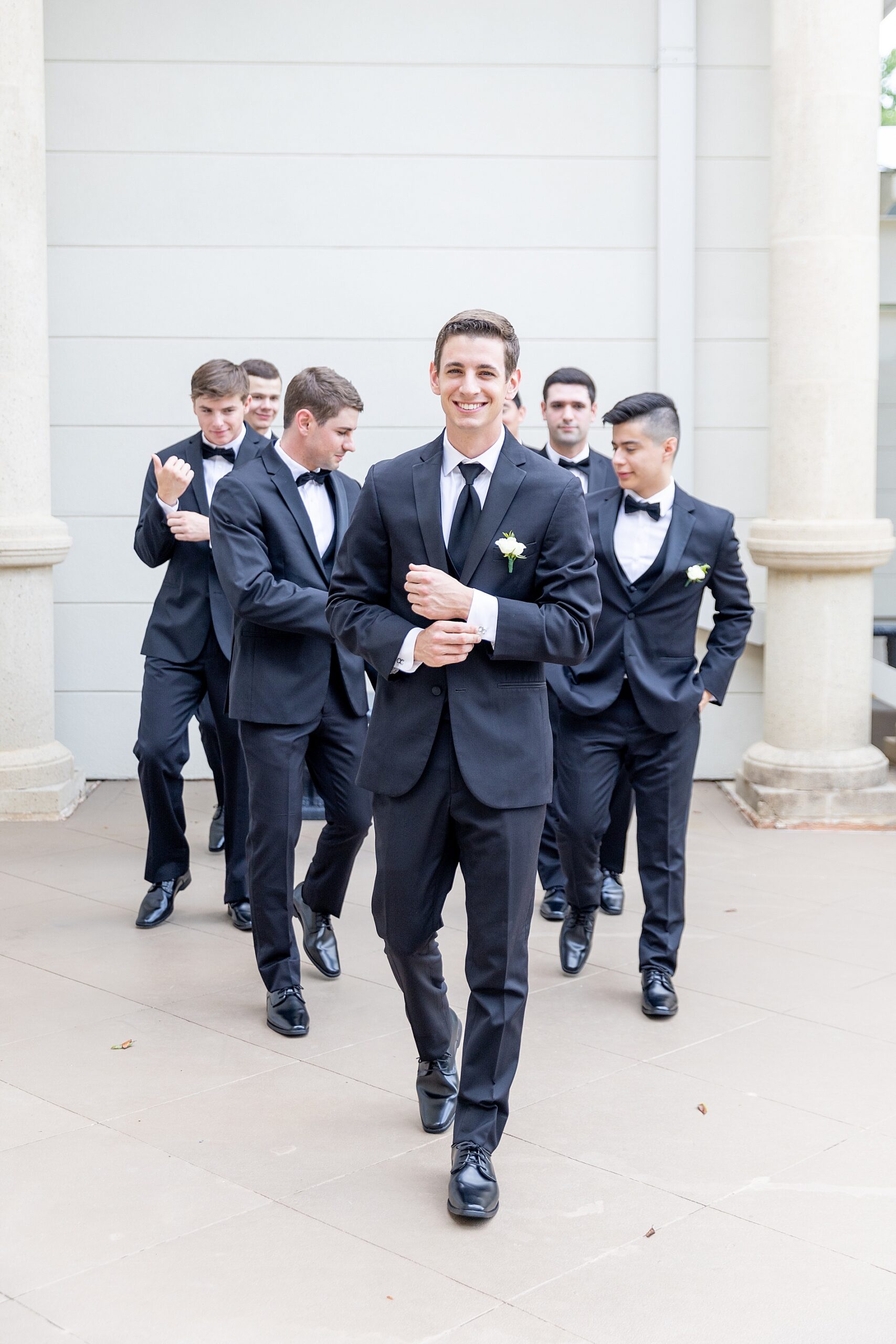 groom and groomsmen walks together