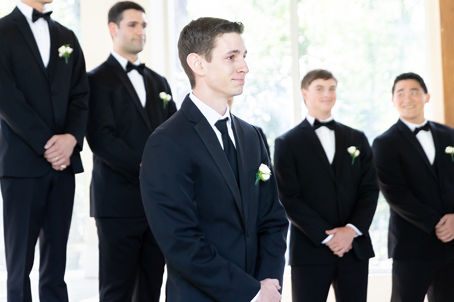 groom tears up seeing bride walking down the aisle