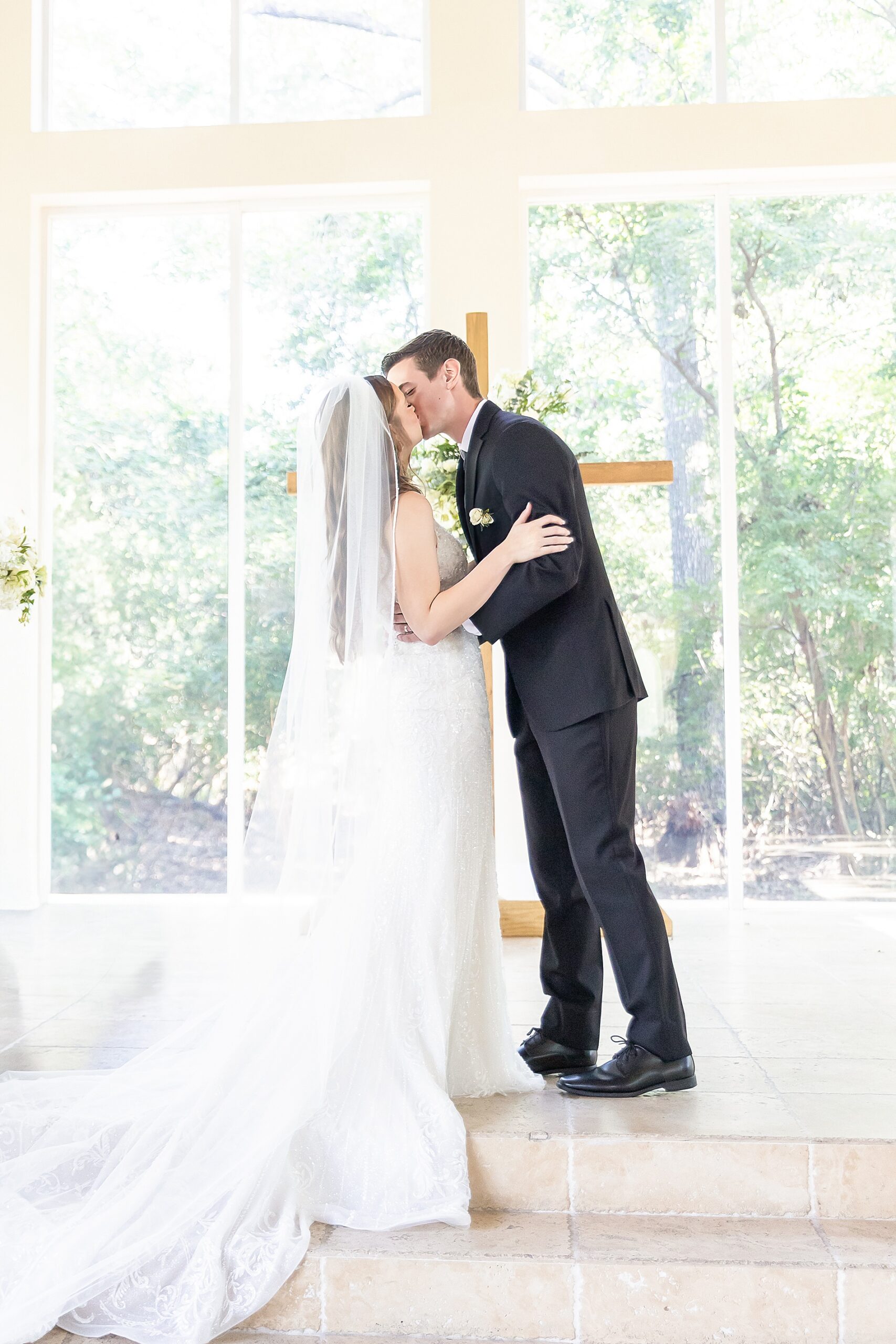 newlyweds kiss at wedding ceremony 