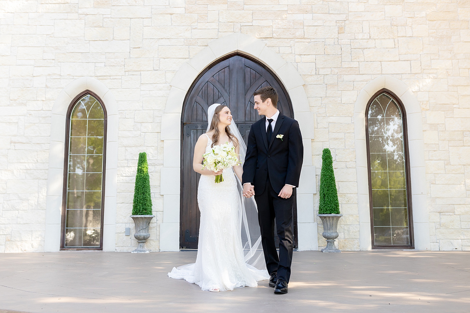 bride and groom portraits outside of chapel