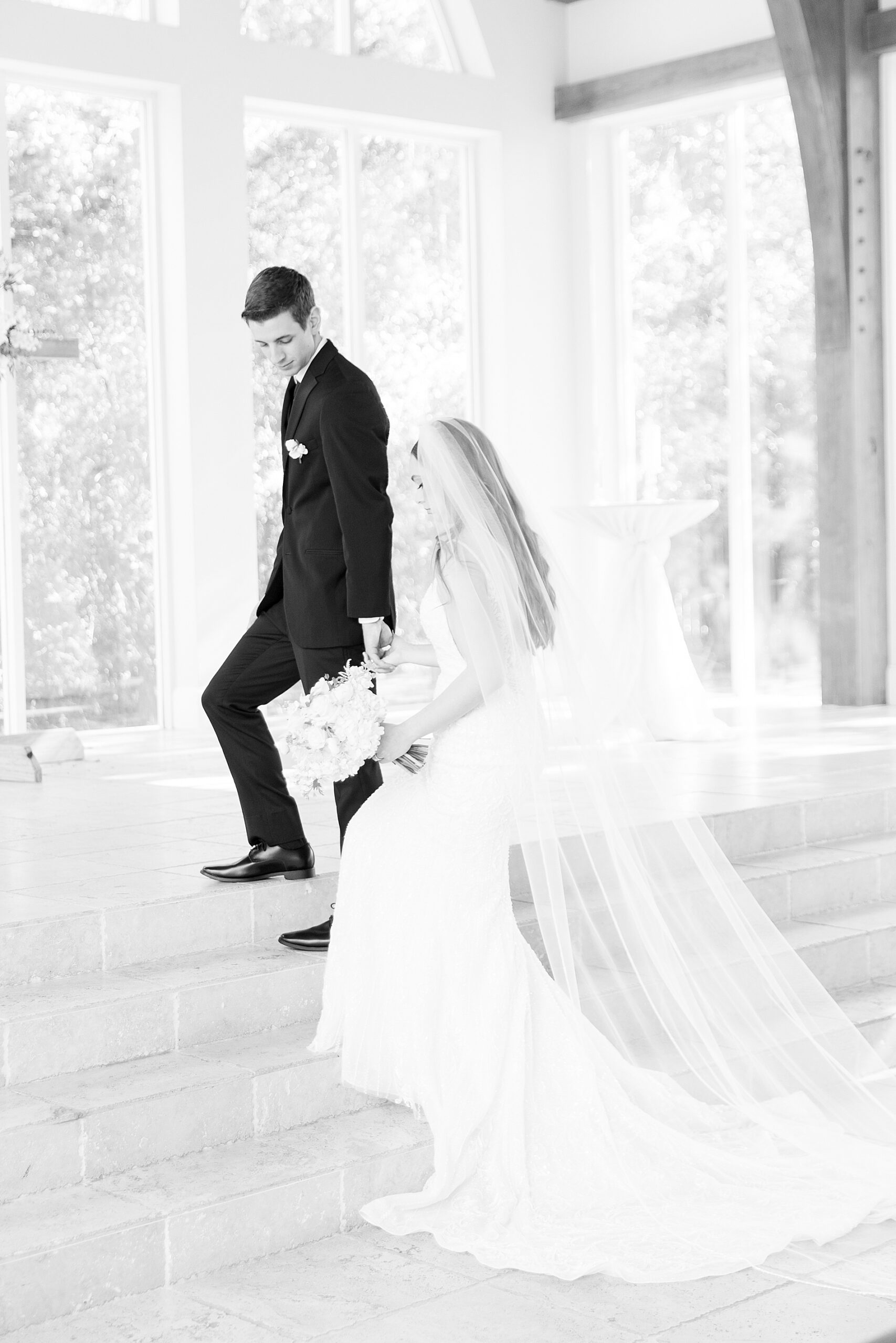 newlyweds walk up stairs