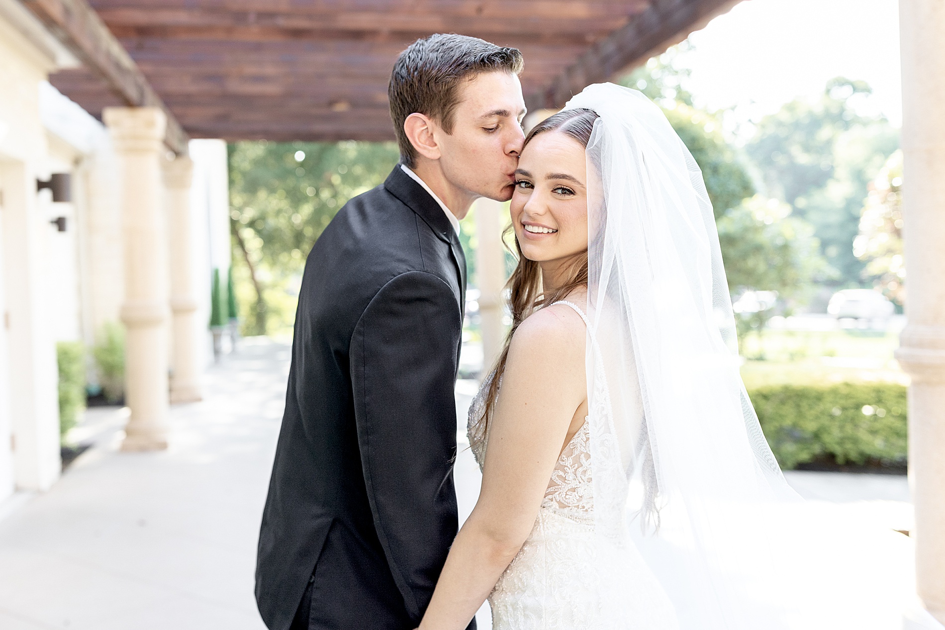 groom kisses his bride