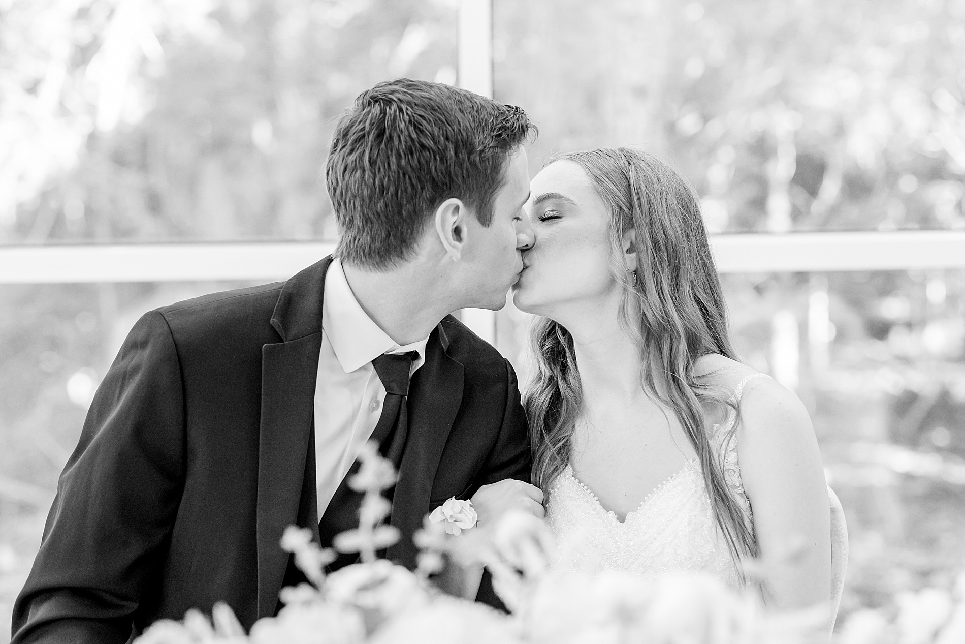 newlyweds kiss at reception