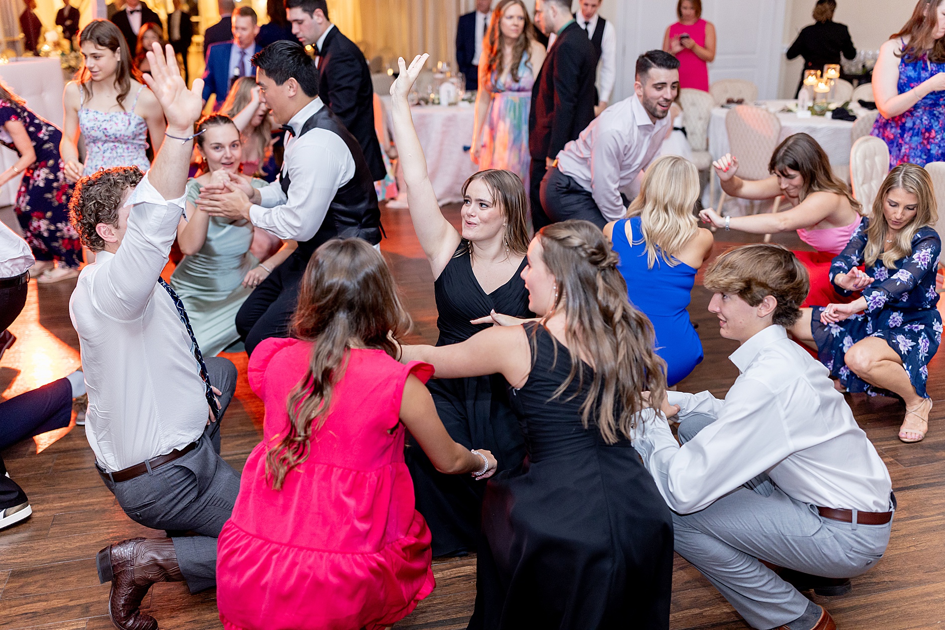 guests dance at wedding 