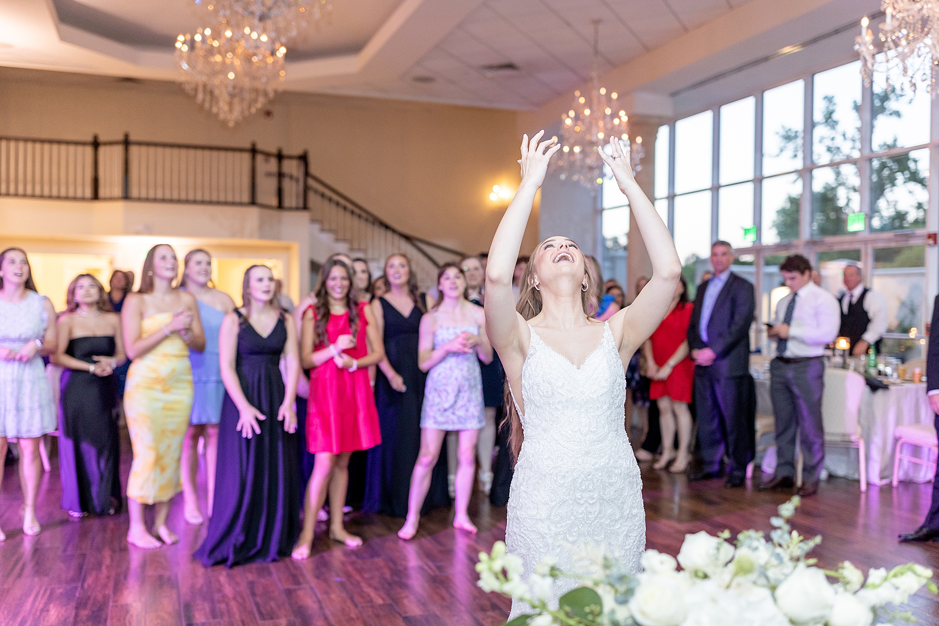 bride throws wedding bouquet 