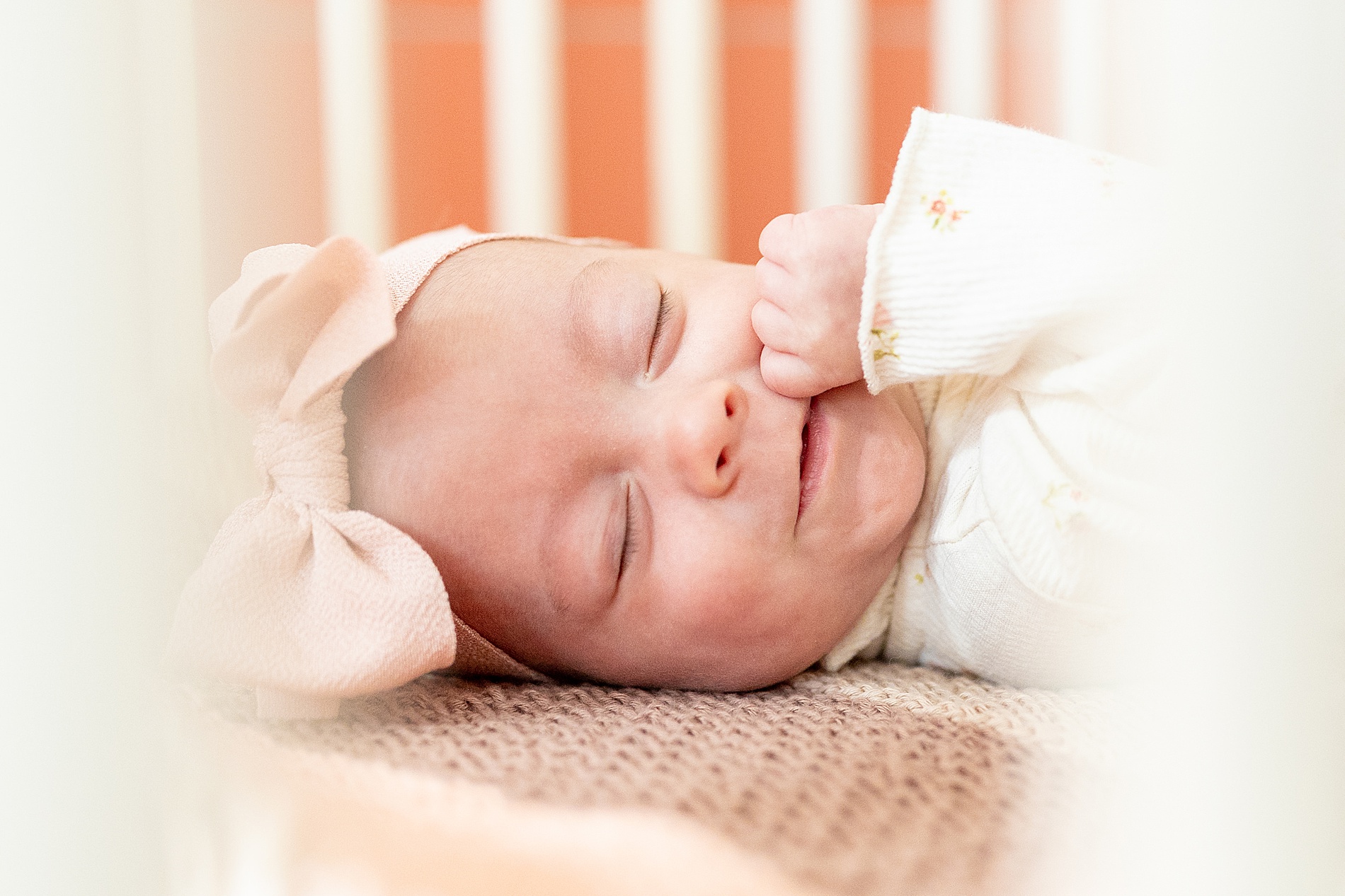 sweet newborn girl in crib