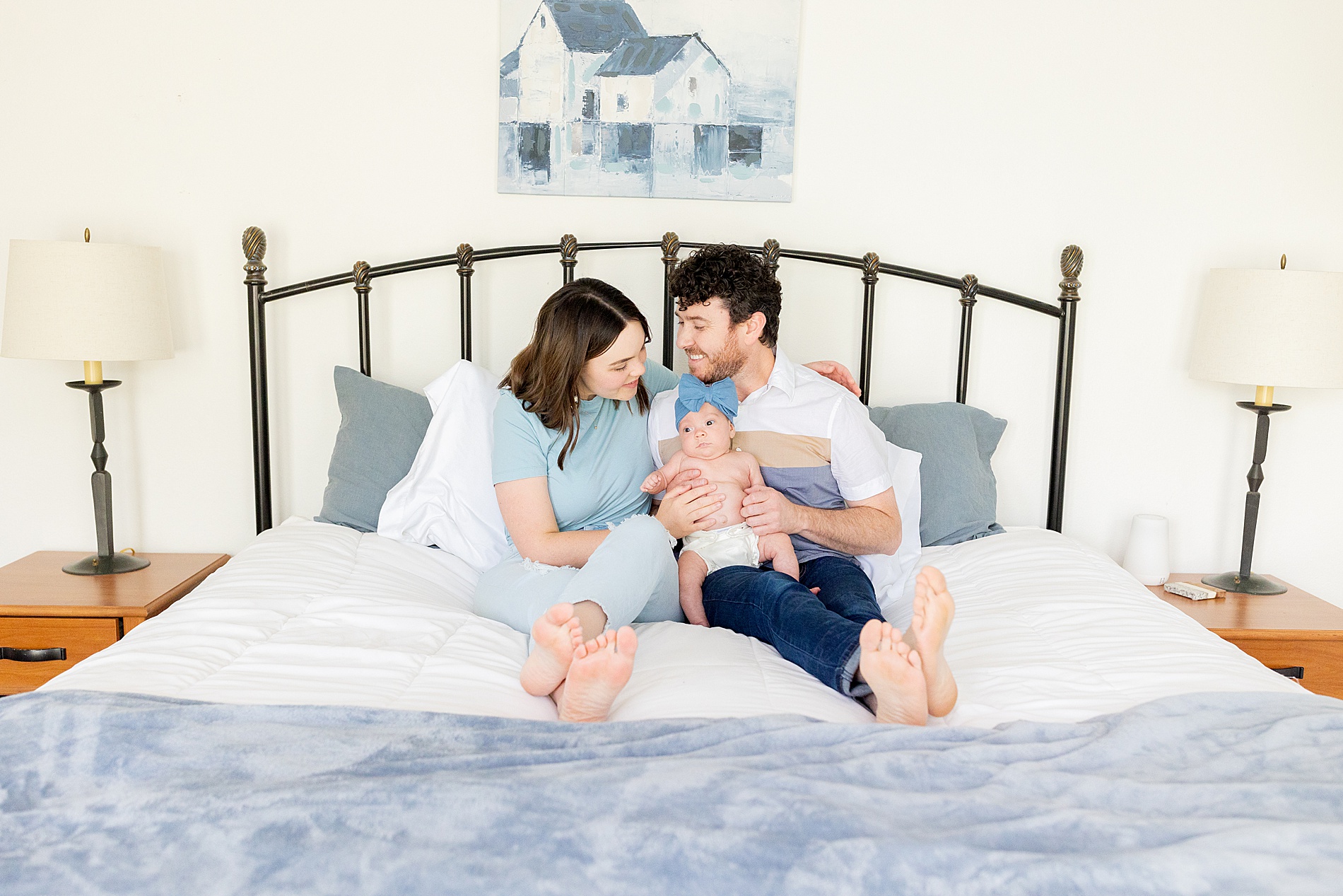 parents hold newborn during Cozy In-Home Newborn and Lifestyle Session