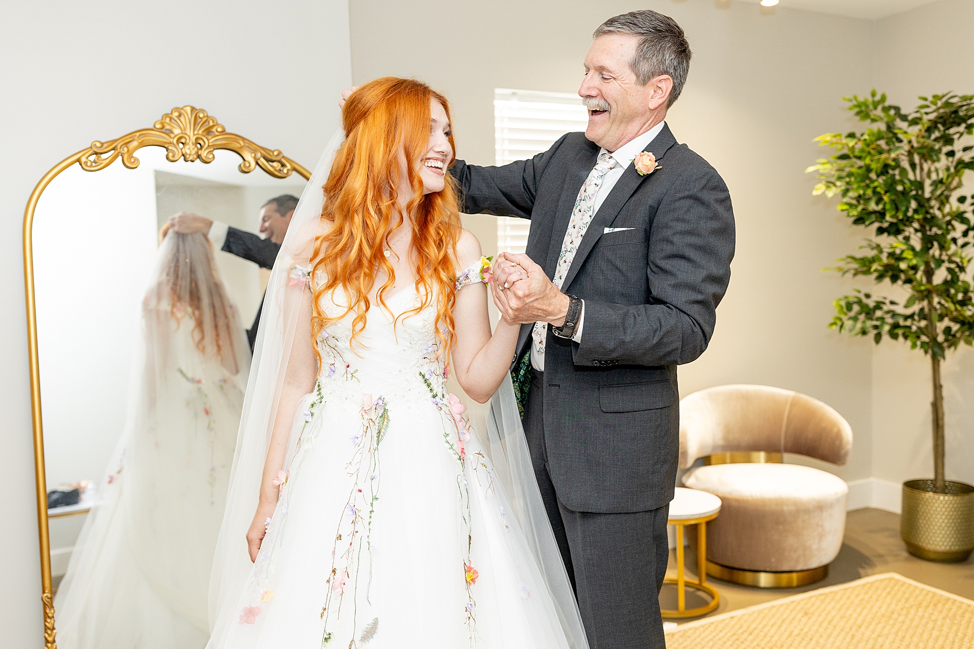 dad helps bride with veil