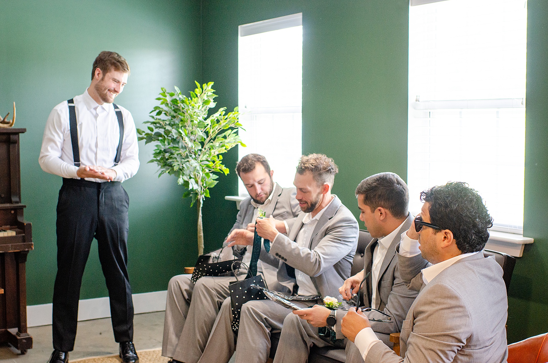 groom gives groomsmen gifts