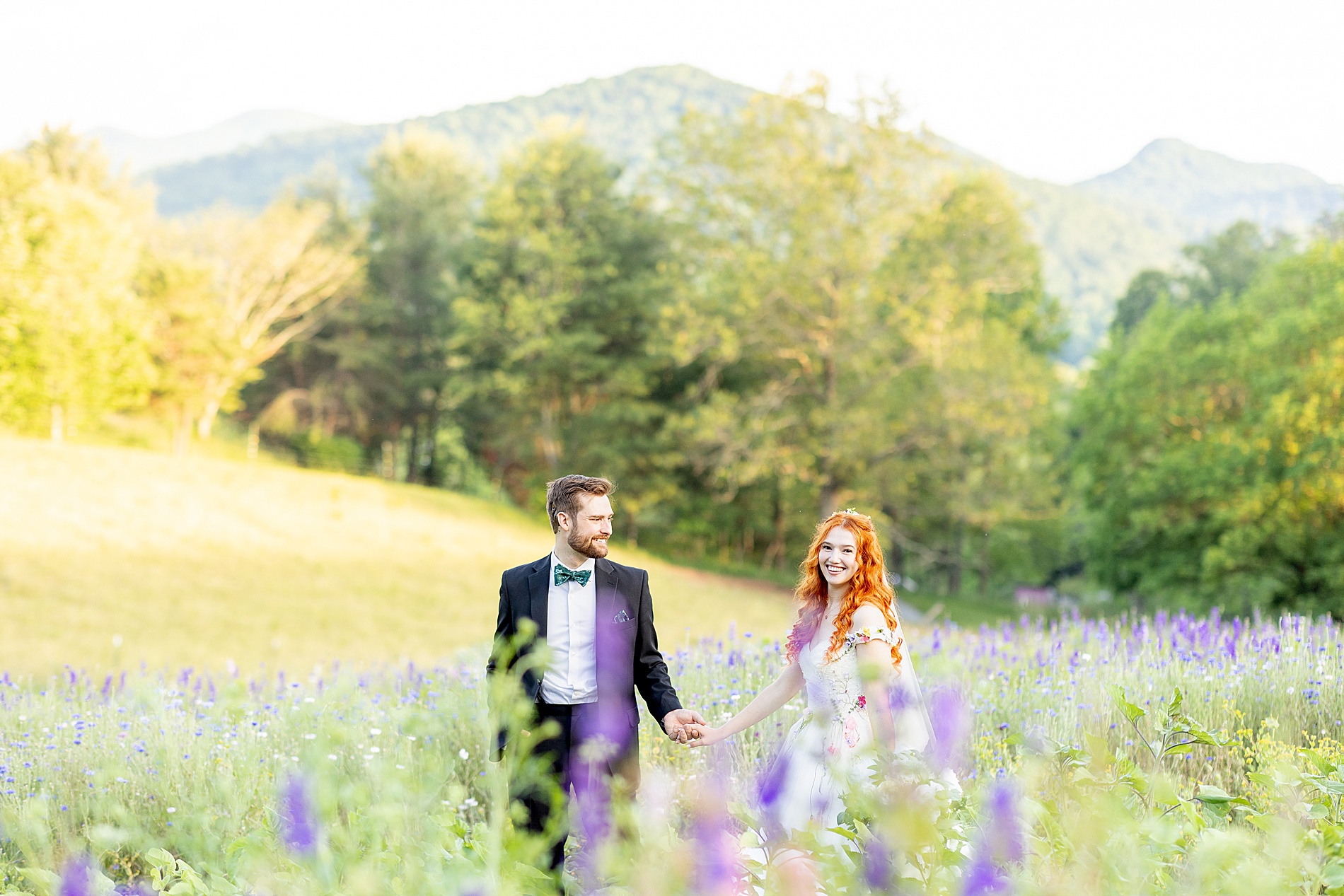 couple in field of flowers in Asheville, NC 