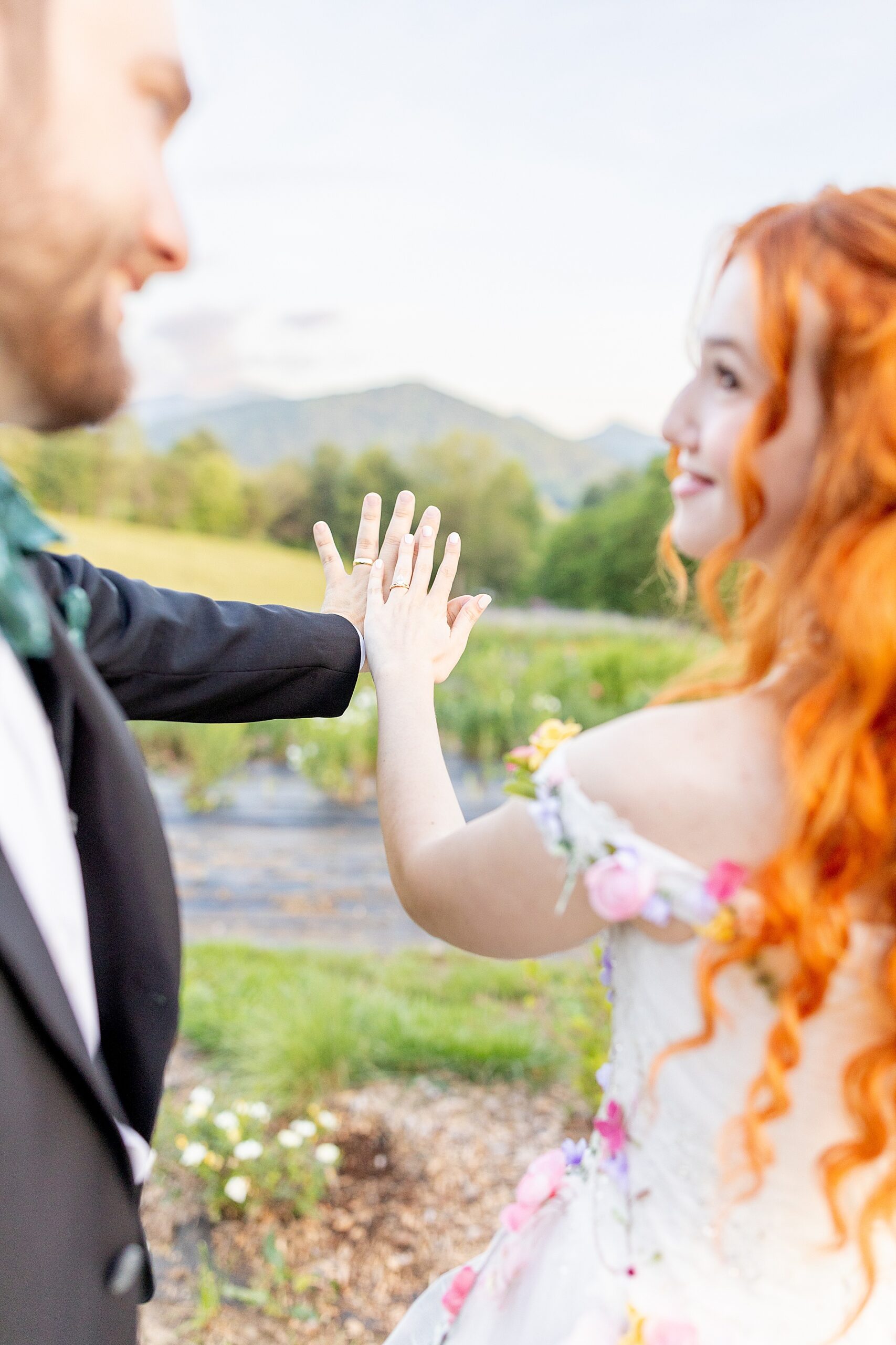 bride and groom hold hands out together