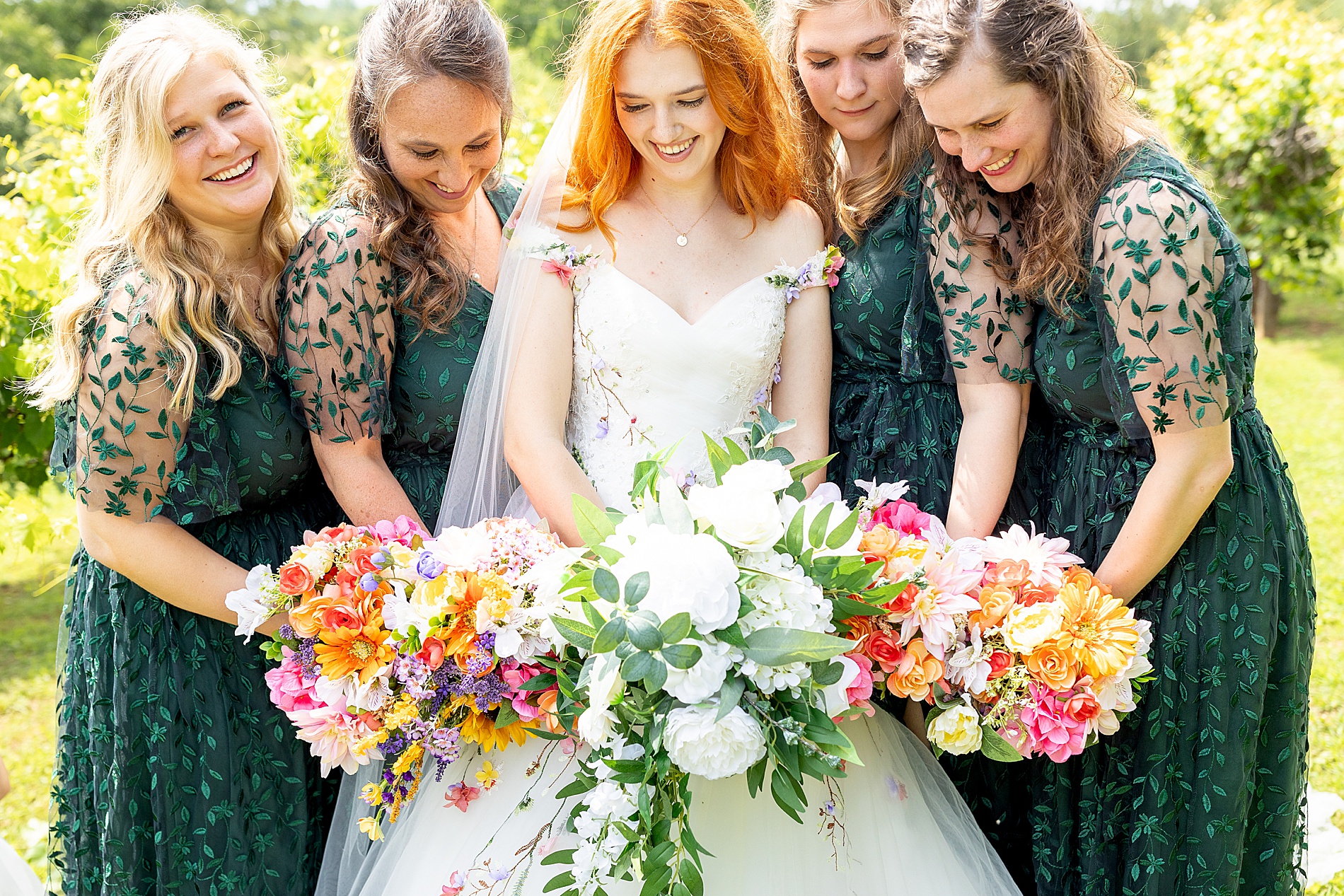 bridesmaids with colorful wedding bouquets