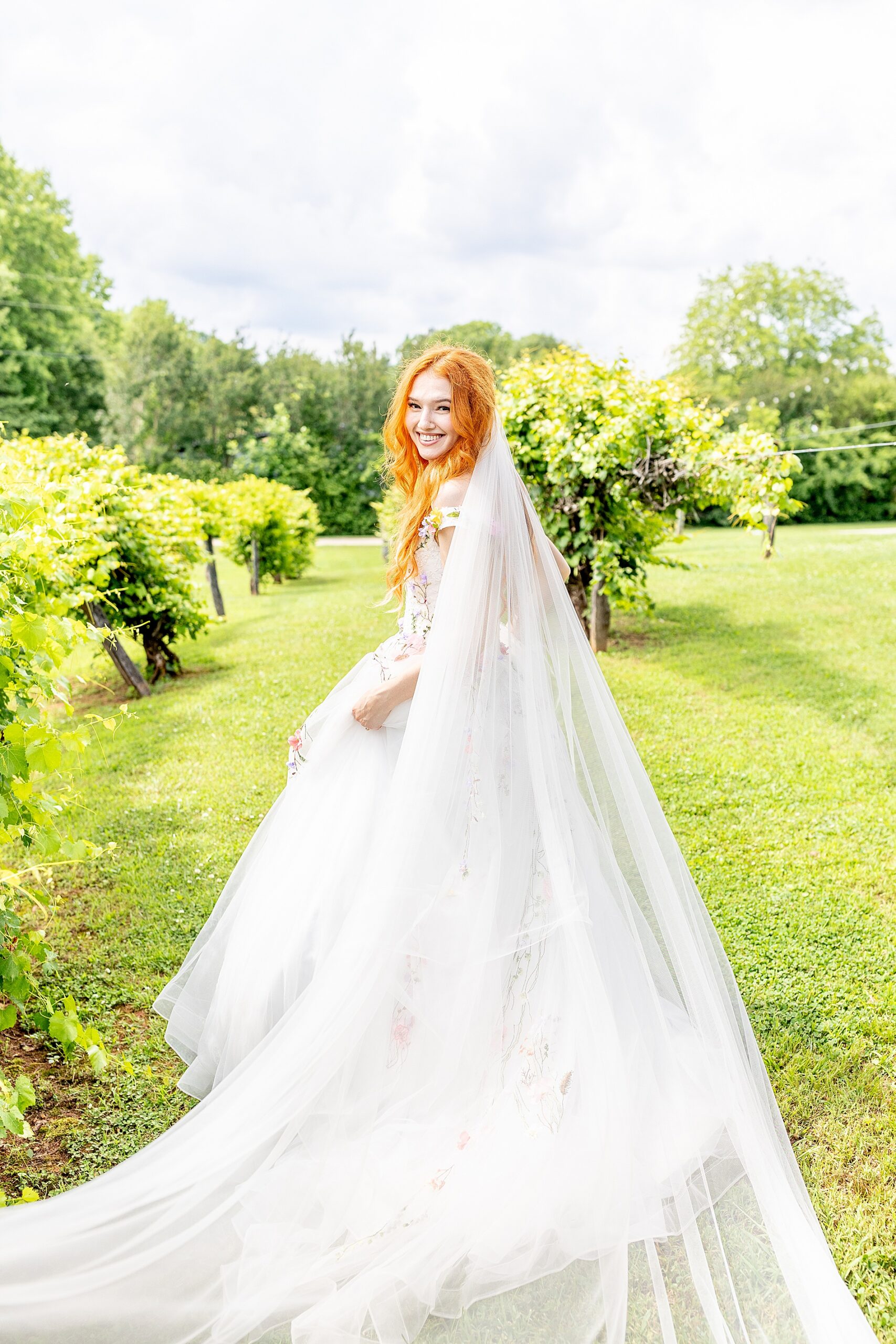 bride's veil trails behind her