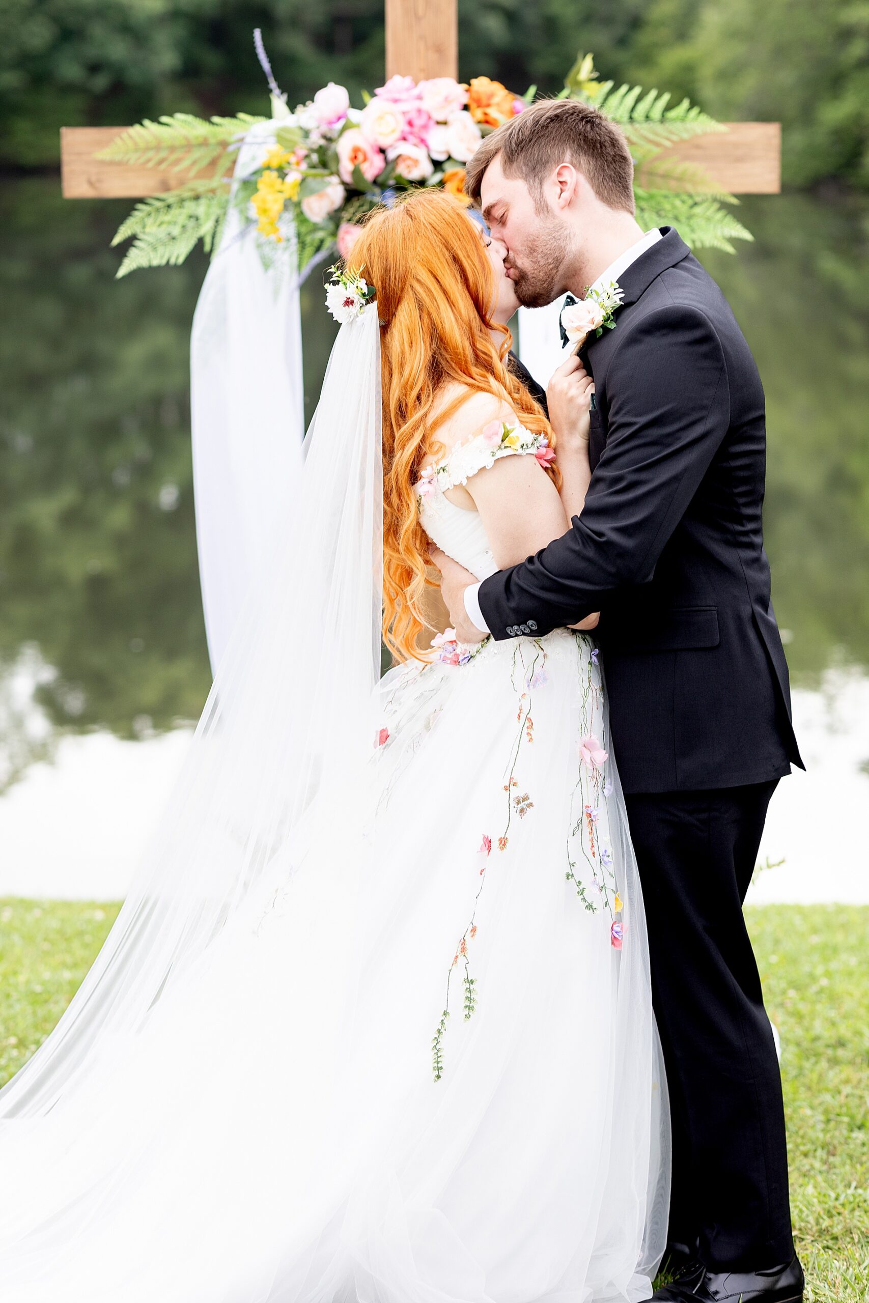 couple kiss as they are pronounced husband and wife