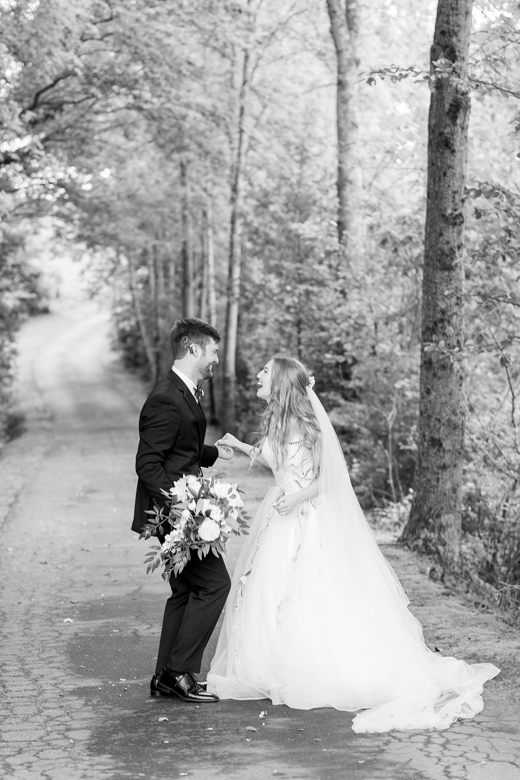 couple laugh together after wedding 